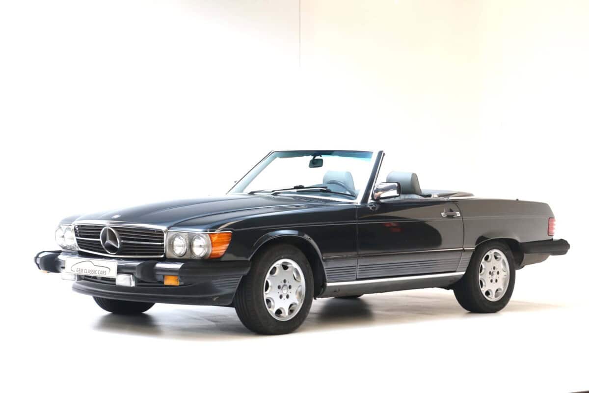 Exterior view of a vintage black Mercedes-Benz convertible car.
