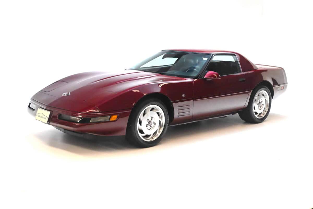 Exterior view of a vintage red Corvette sports car, showcasing its sleek design.