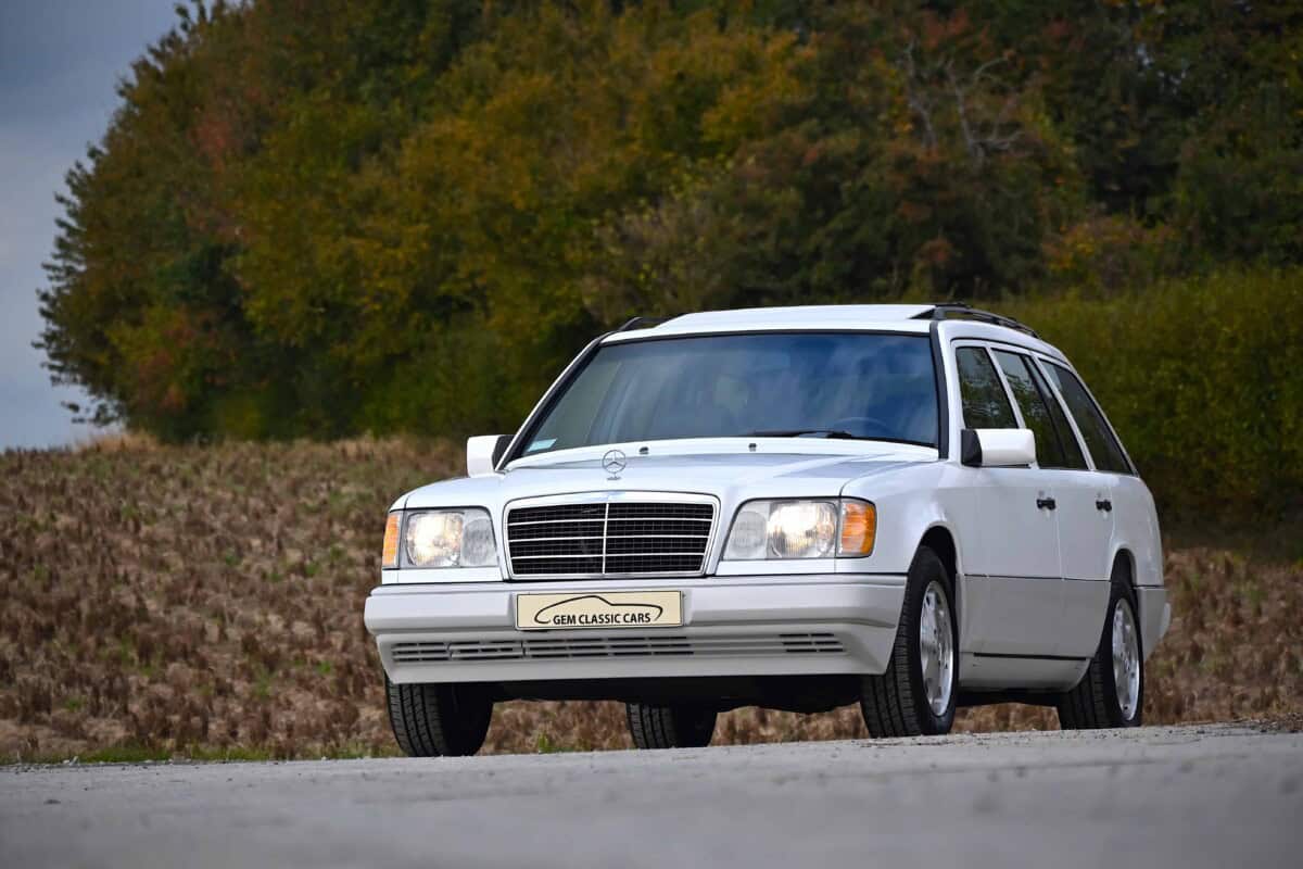 Exterior view of a vintage Mercedes-Benz station wagon on the road.