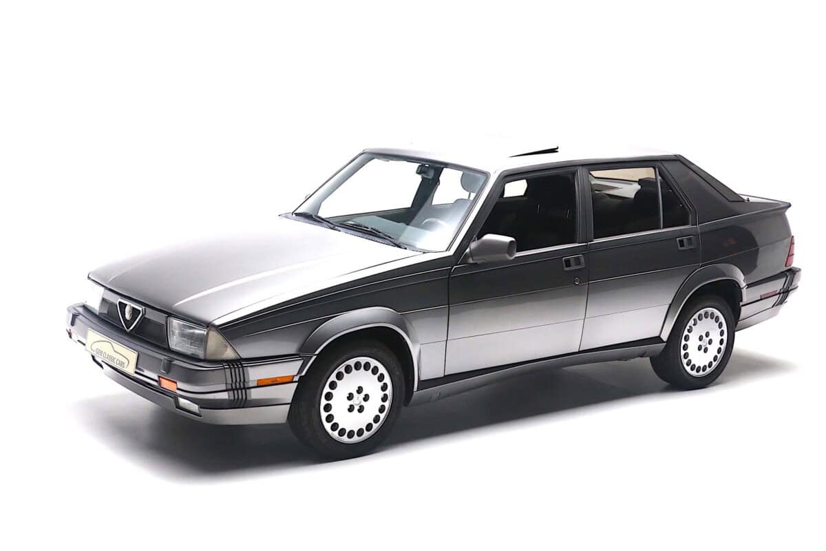 Exterior shot of a vintage silver sedan car, classic design, clean background.