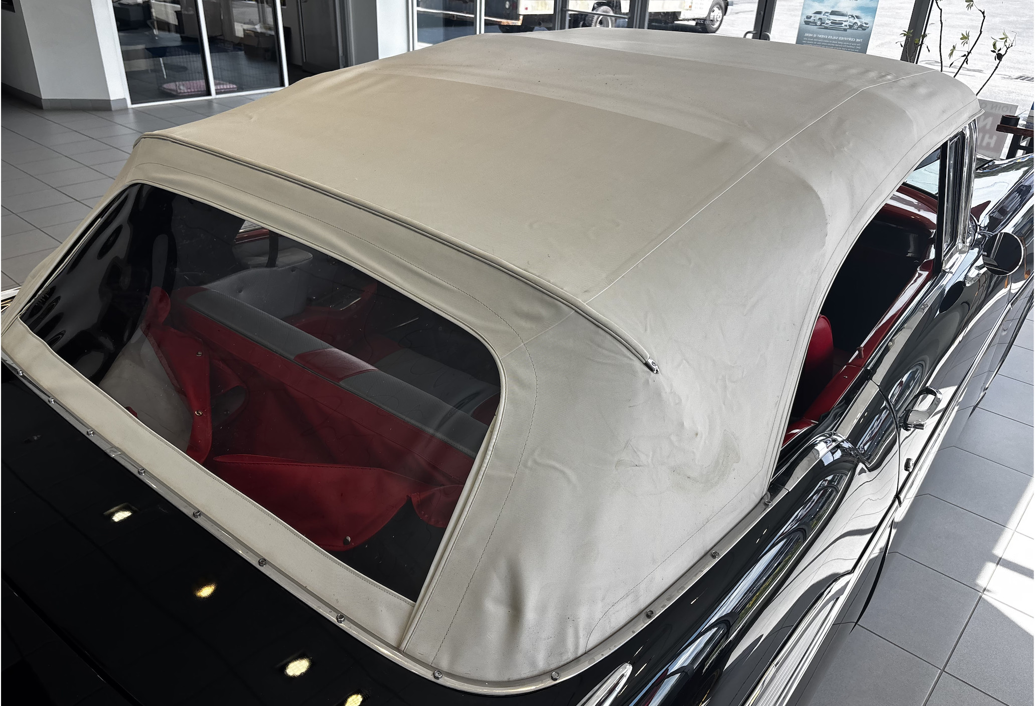 1955 Chevrolet BEL AIR — Close-up of classic car convertible roof and rear window.