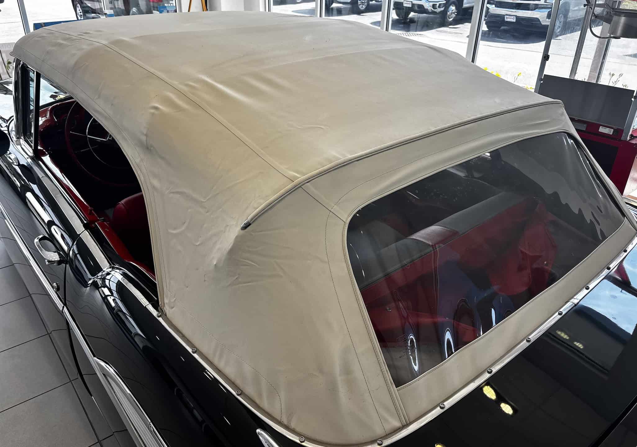 1955 Chevrolet BEL AIR — Close-up of classic car convertible roof and rear window.