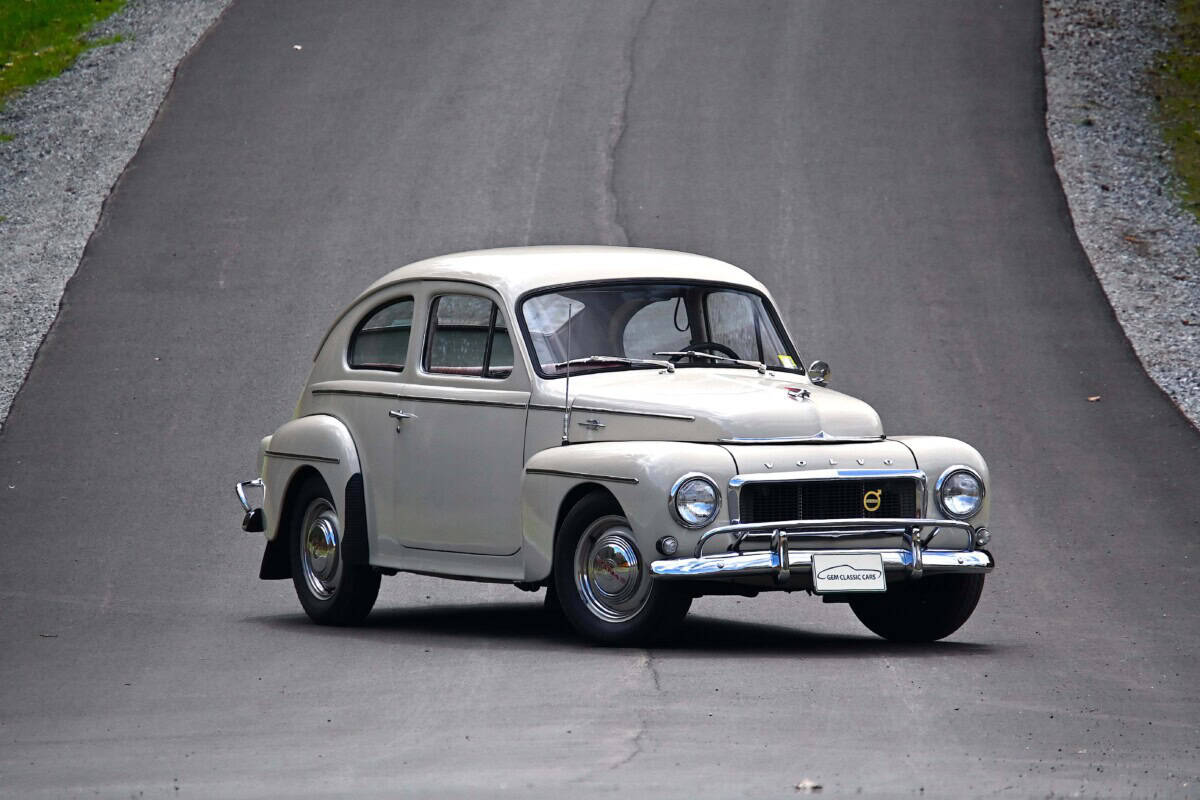 Vintage white classic car on the road, exterior shot.