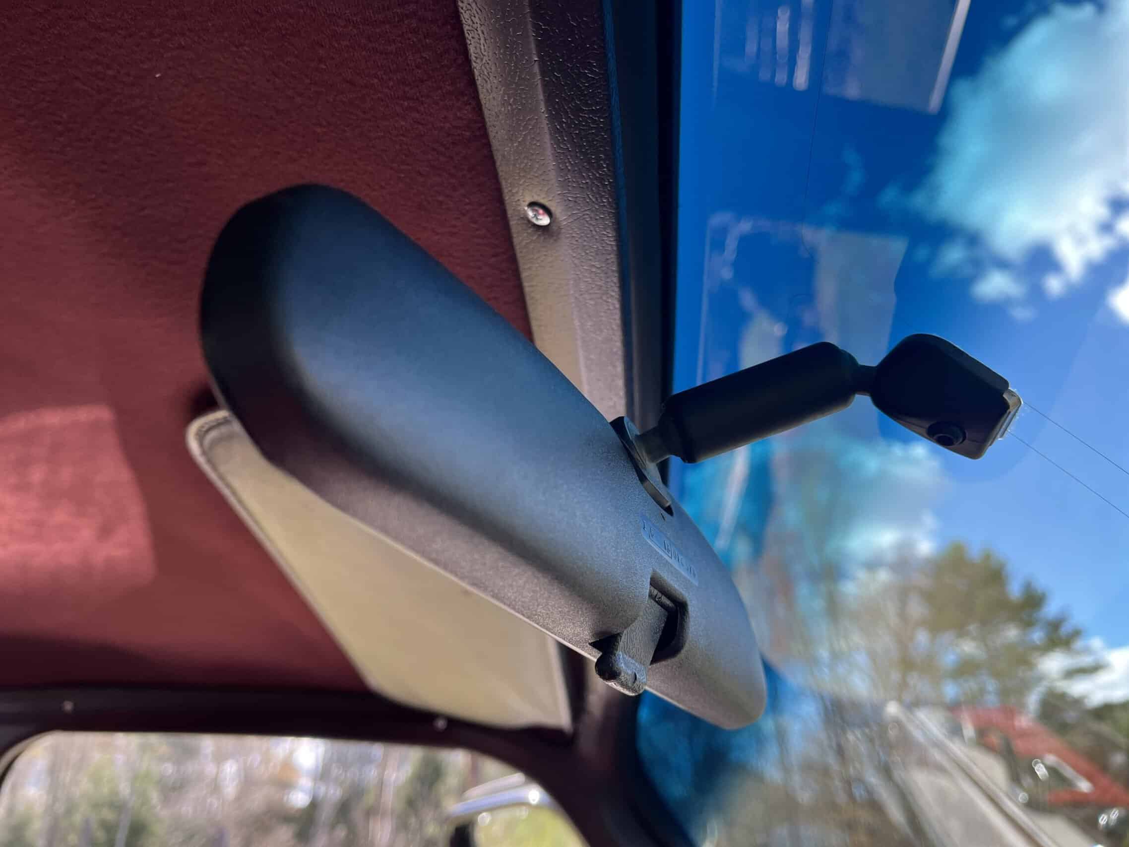 1986 Chevrolet SILVERADO — Interior shot of classic car showing sun visor and rearview mirror.