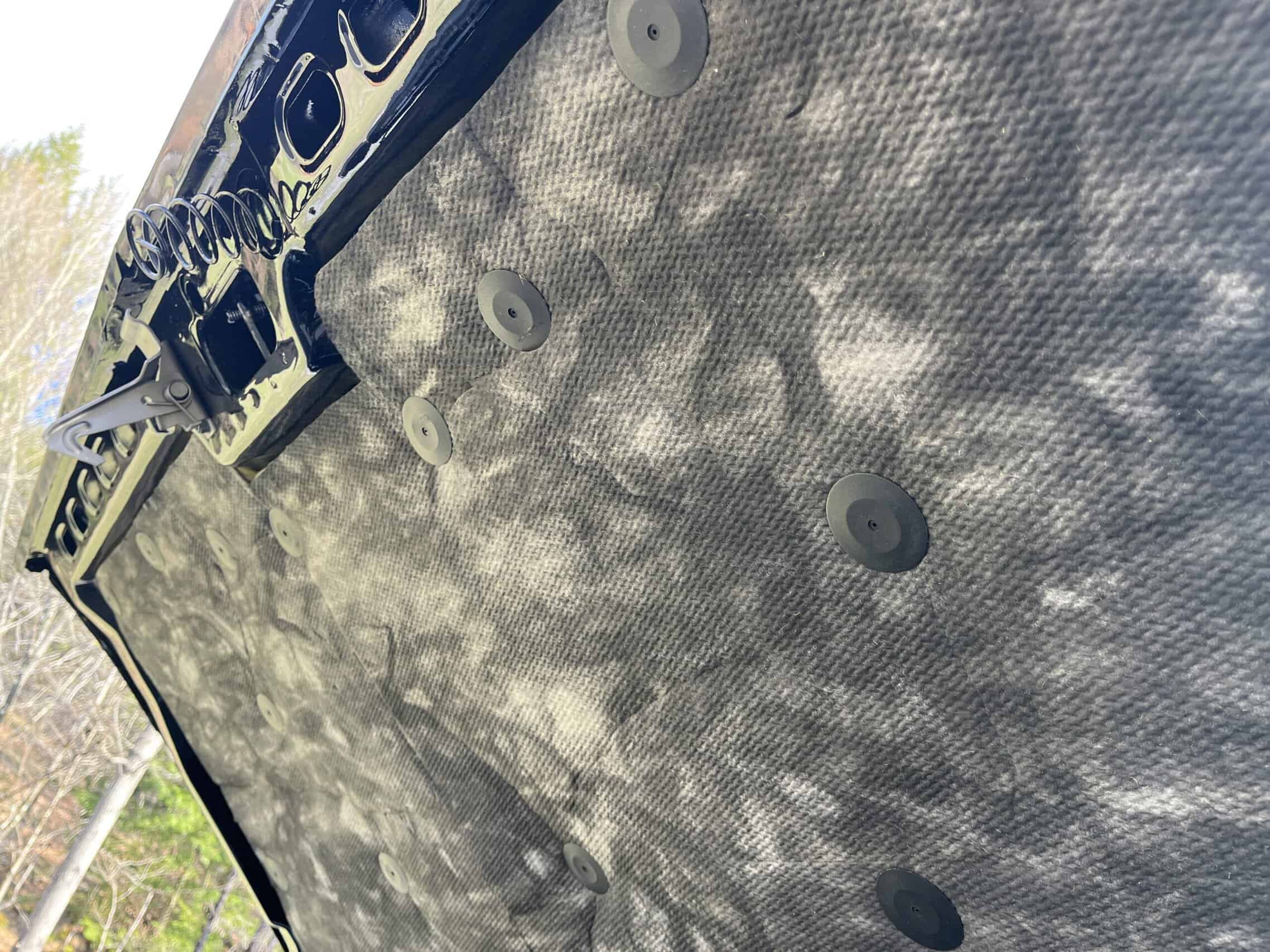 1986 Chevrolet SILVERADO — Close-up of classic car interior with carbon fiber panel and buttons.