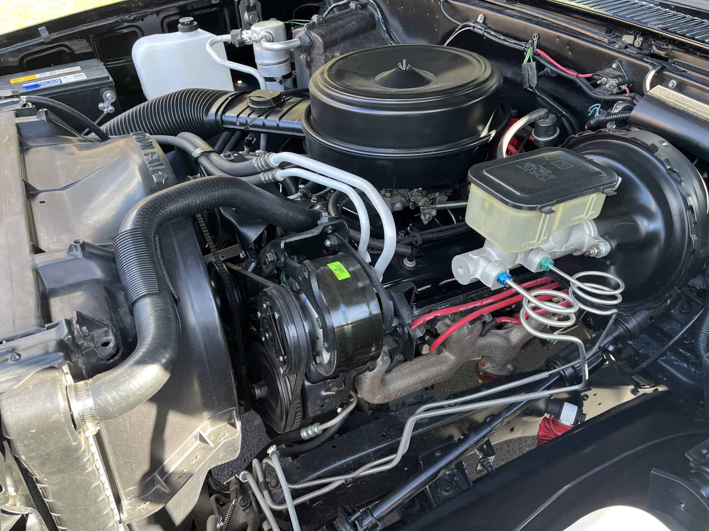 1986 Chevrolet SILVERADO — Engine bay of a classic car showing engine and components.