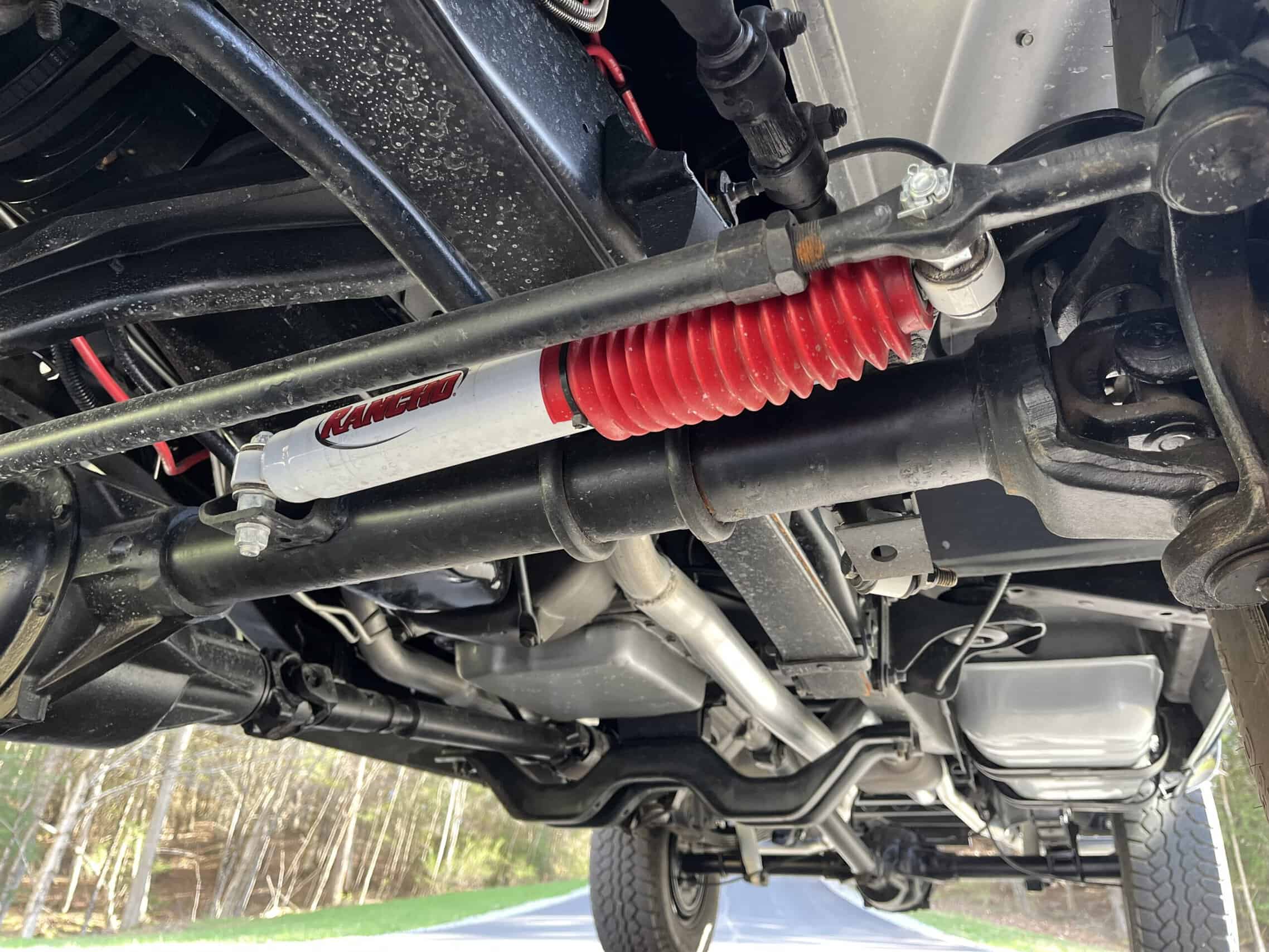 1986 Chevrolet SILVERADO — View of classic car underside showing suspension and exhaust system.