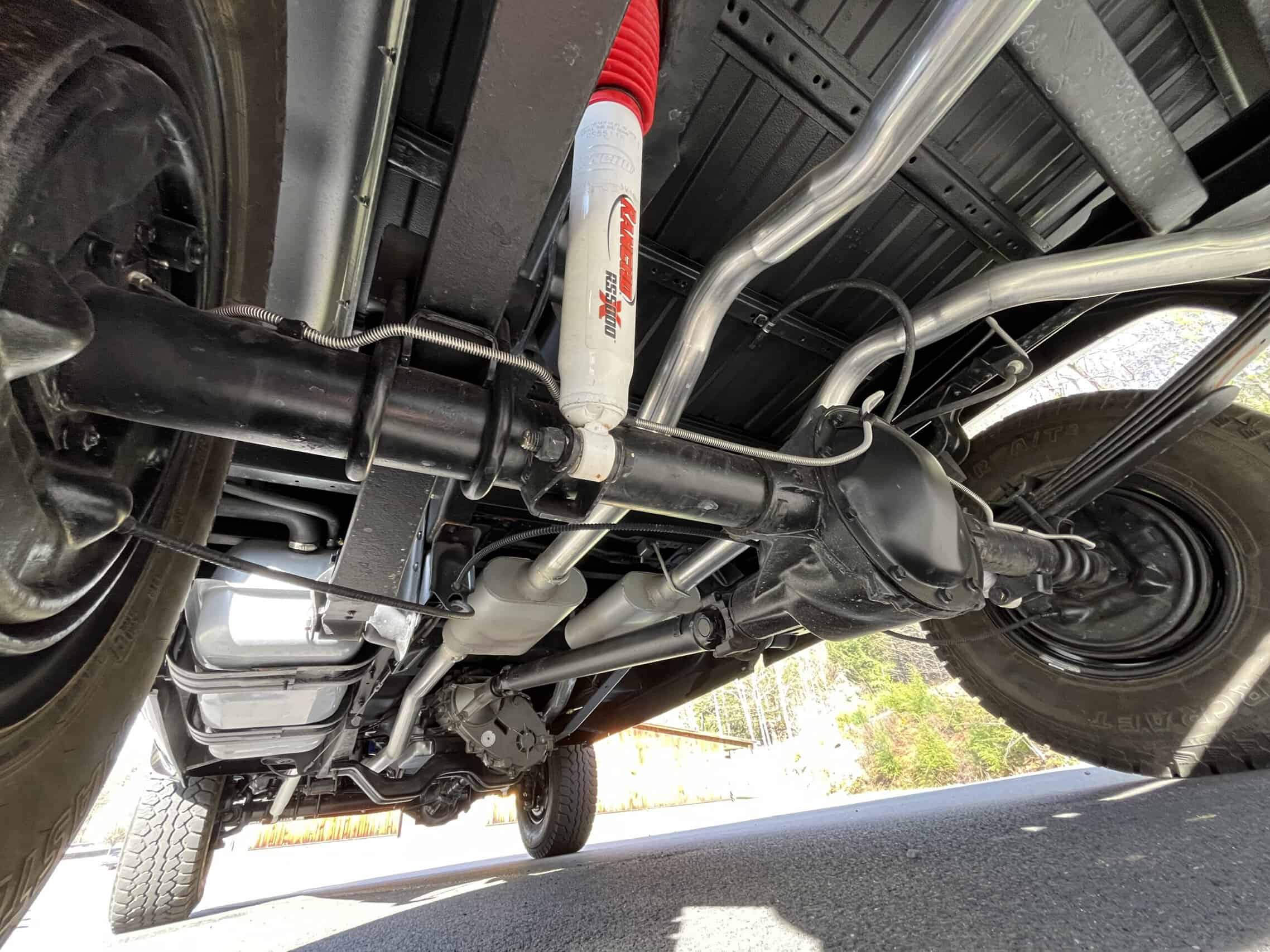 1986 Chevrolet SILVERADO — Underneath view of a classic car showing suspension and exhaust system.