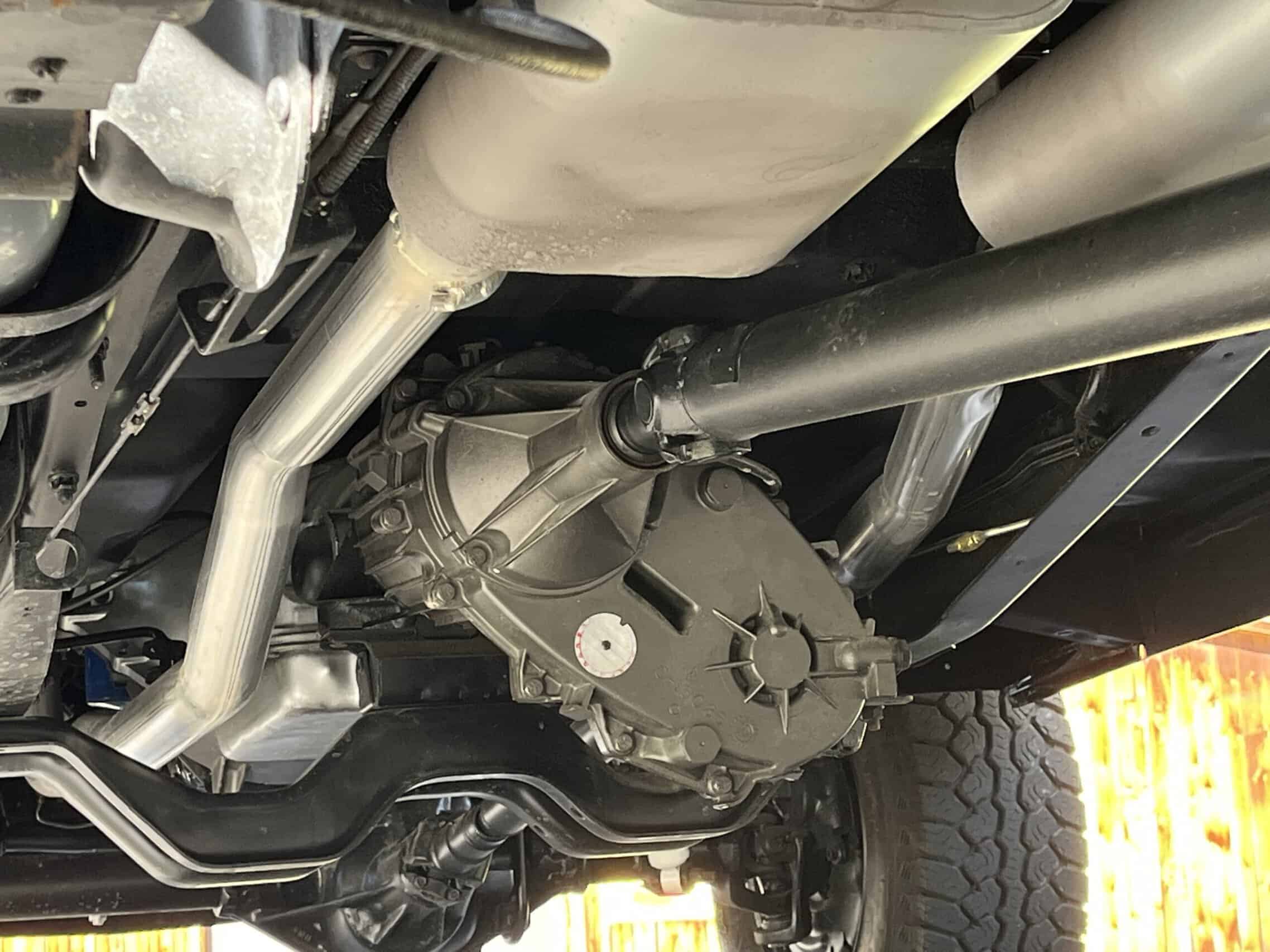 1986 Chevrolet SILVERADO — Close-up of classic car engine and chassis parts.