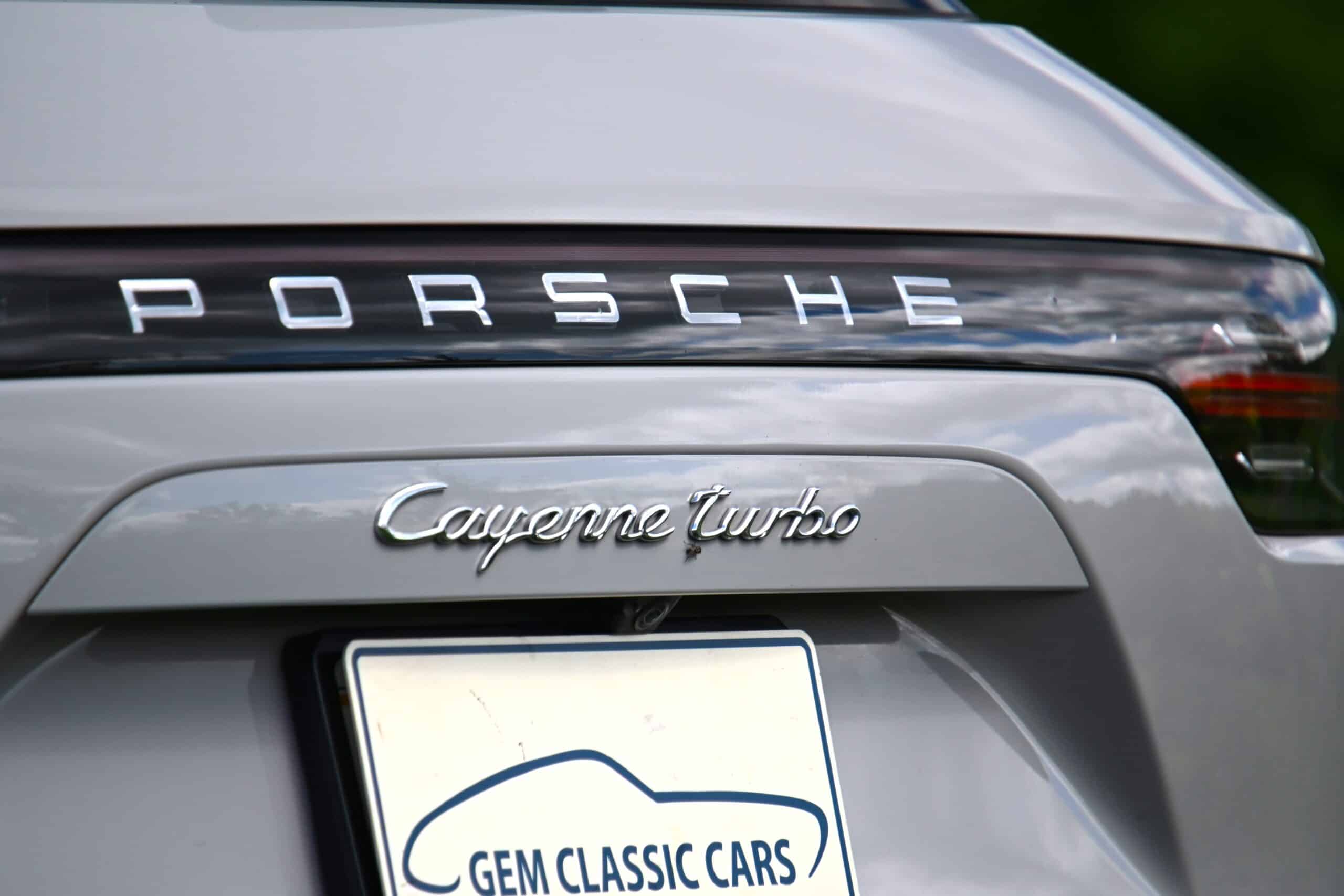2022 Porsche Cayenne — Rear view of classic car showing Porsche badge and Cayenne Turbo badge.