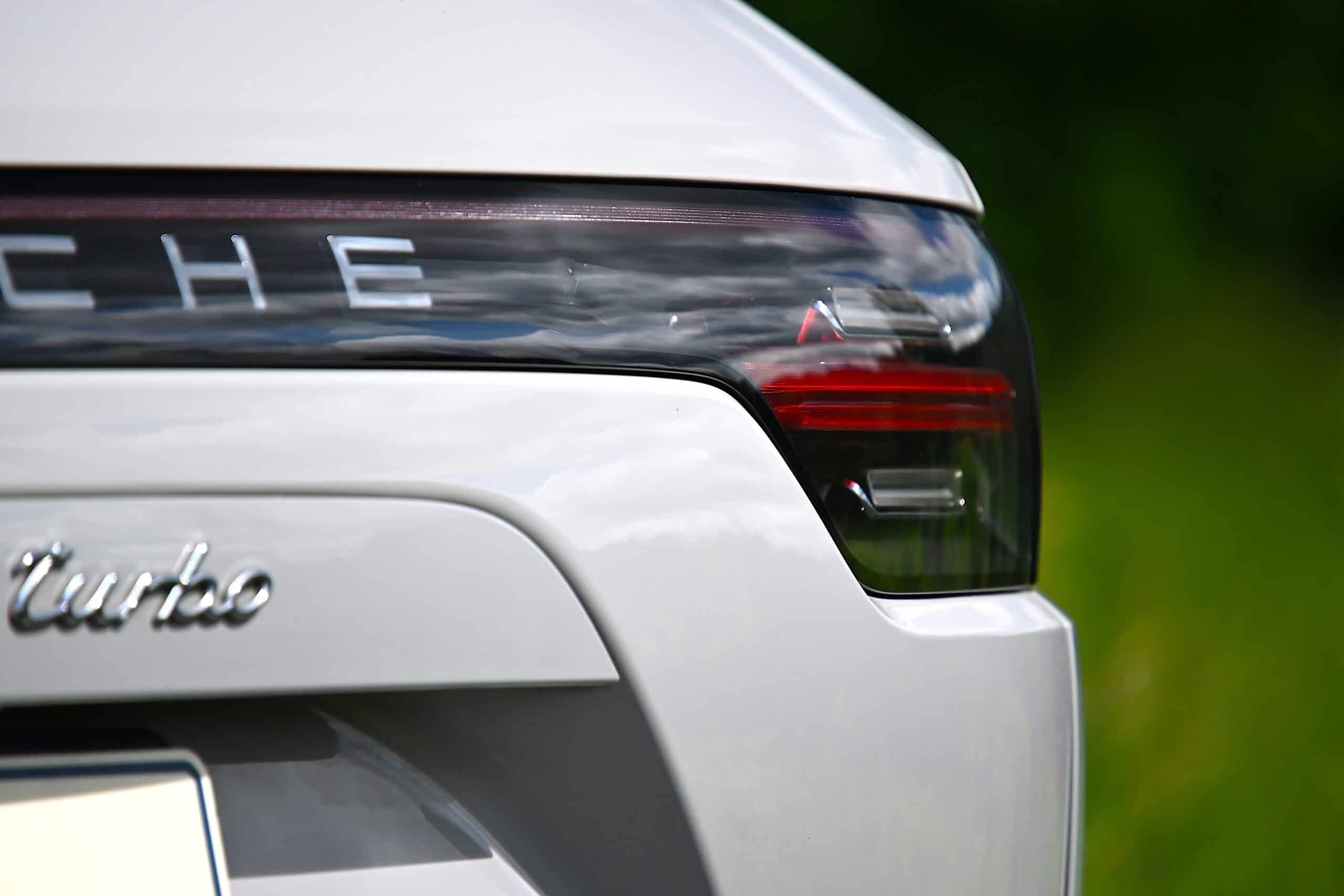 2022 Porsche Cayenne — Exterior shot of a classic car's rear with tail light and badge.