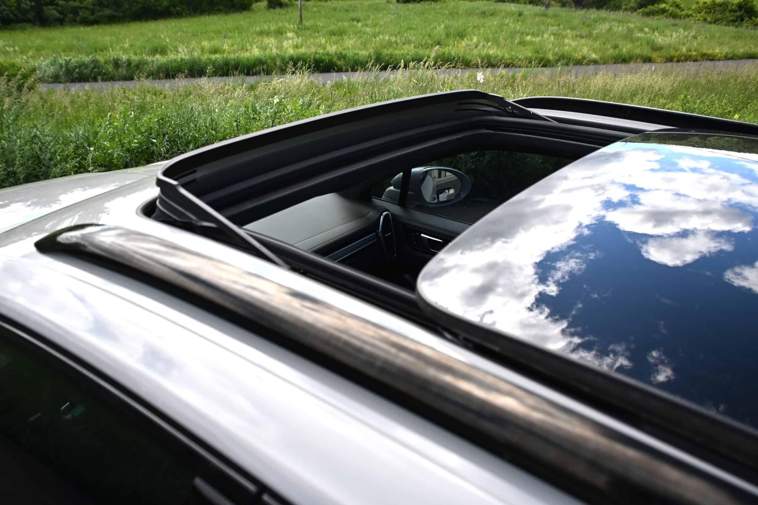 2022 Porsche Cayenne — Close-up of classic car sunroof and interior.