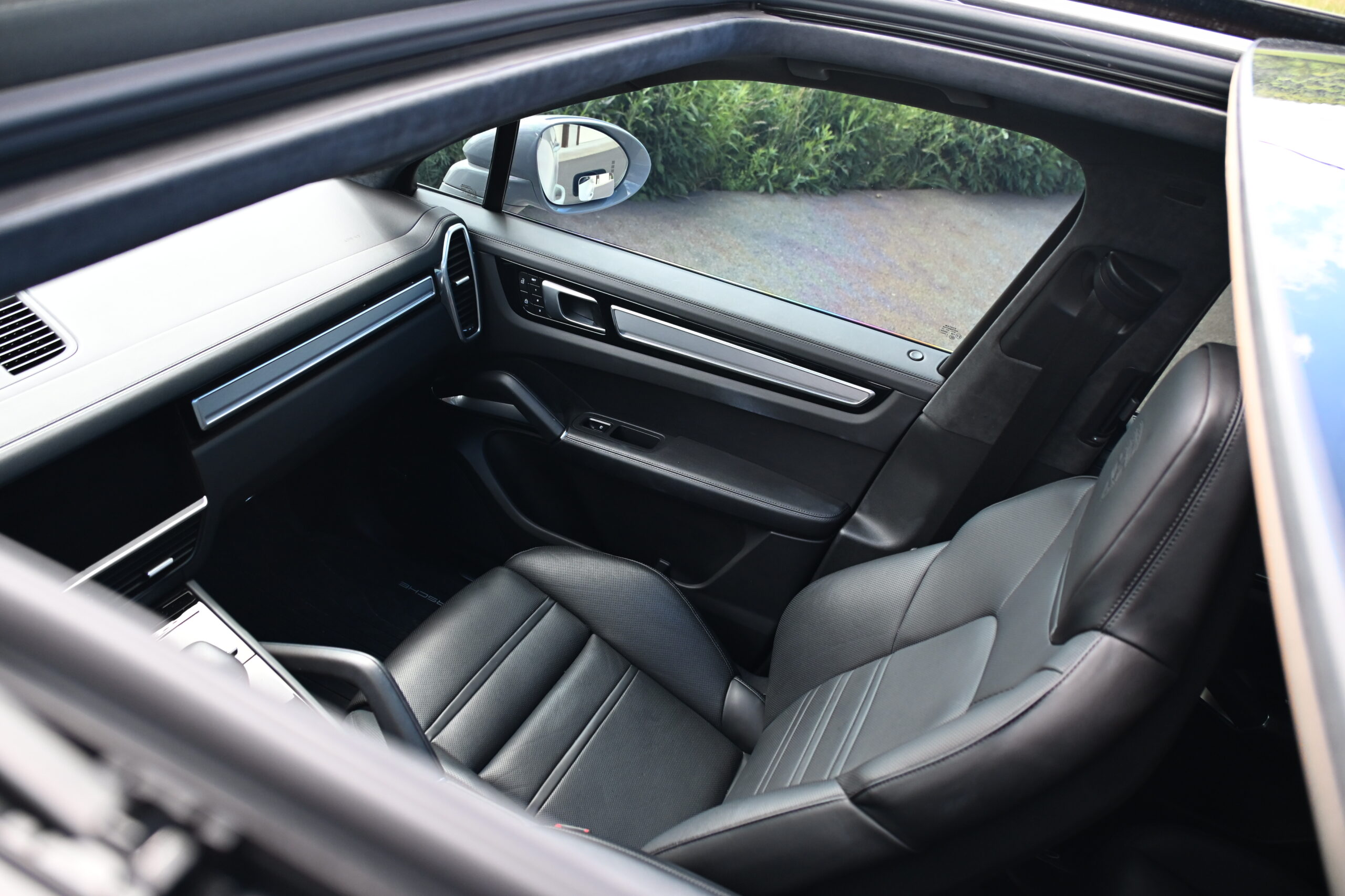 2022 Porsche Cayenne — Interior of a classic car showing leather seats and dashboard.
