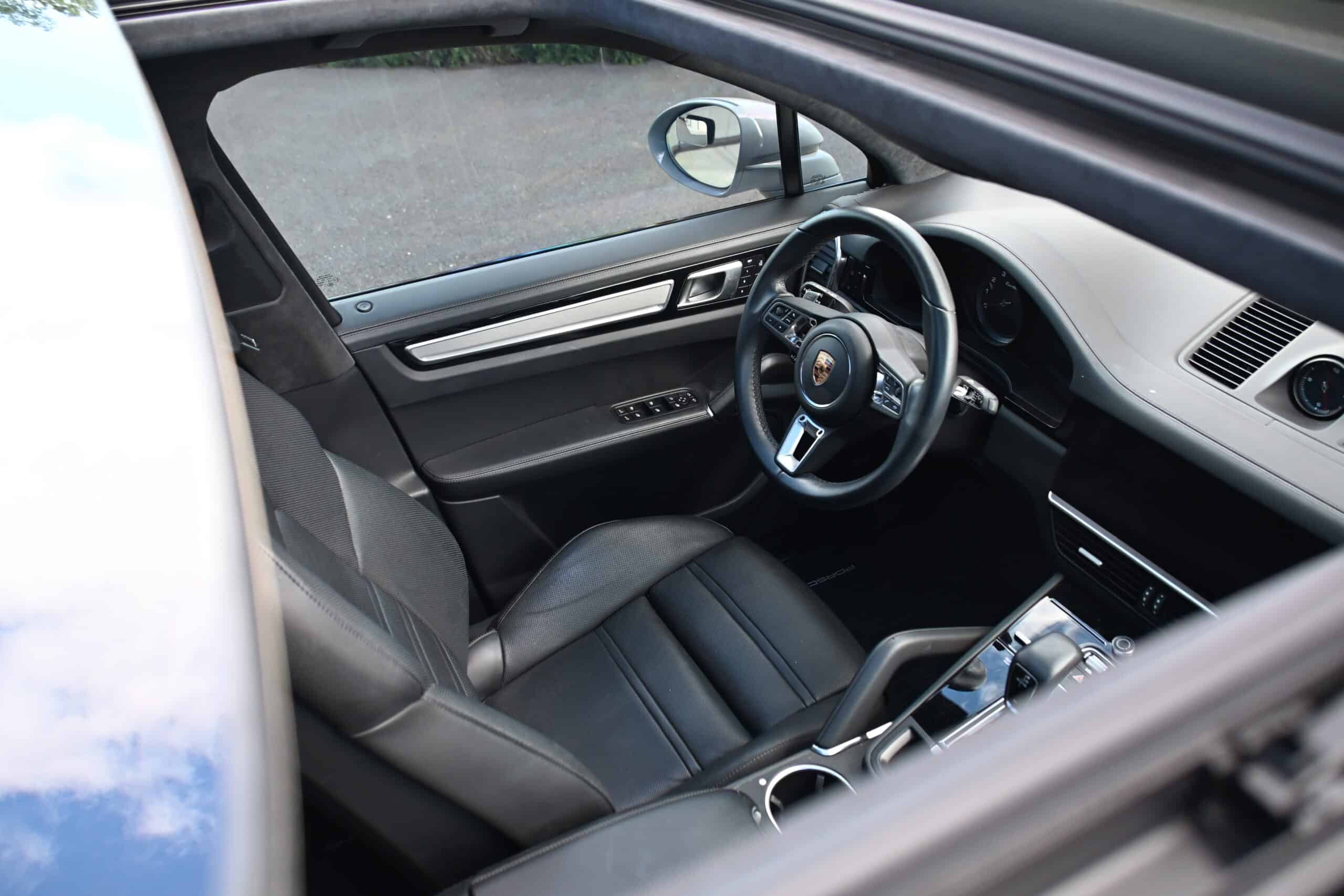 2022 Porsche Cayenne — Interior view of a classic car showing leather seats and dashboard.