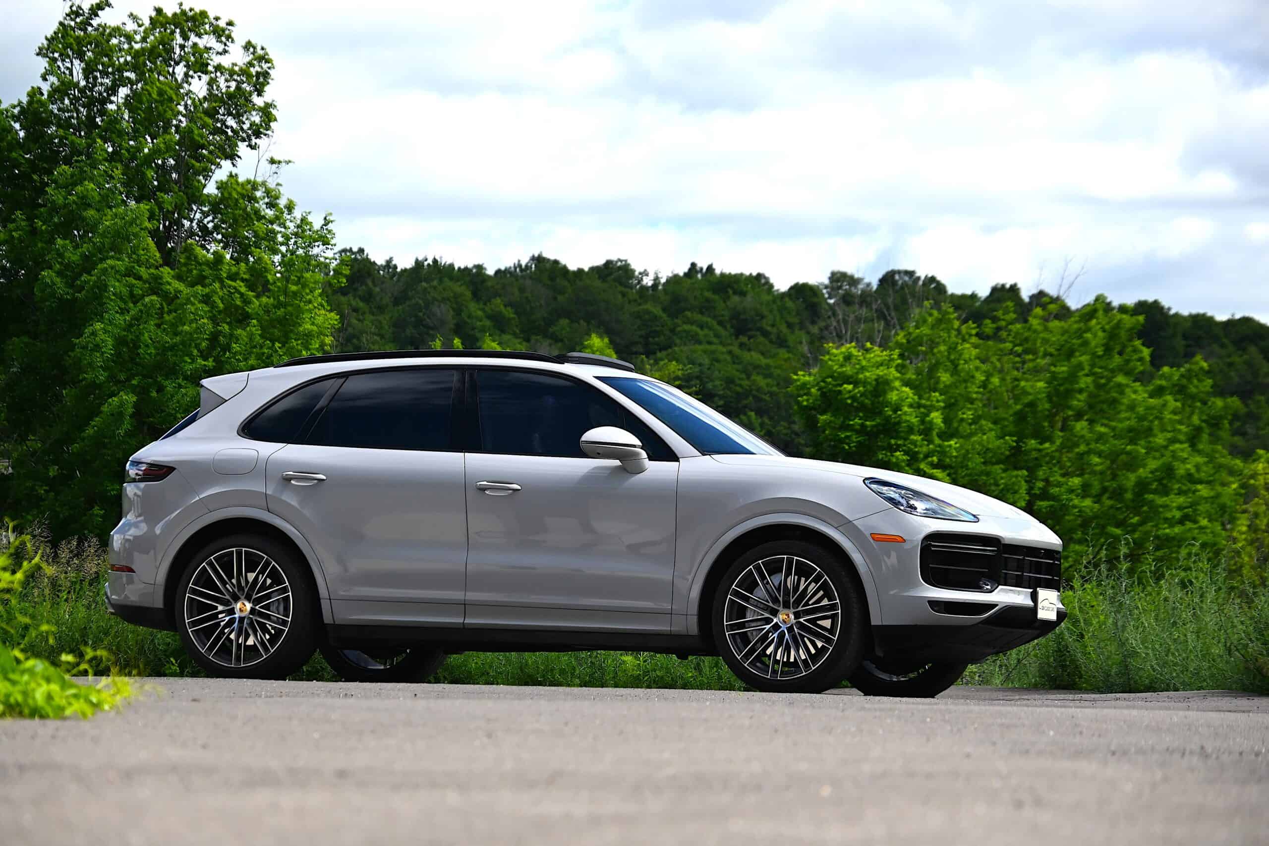 Side view of a classic car with sleek design and alloy wheels.