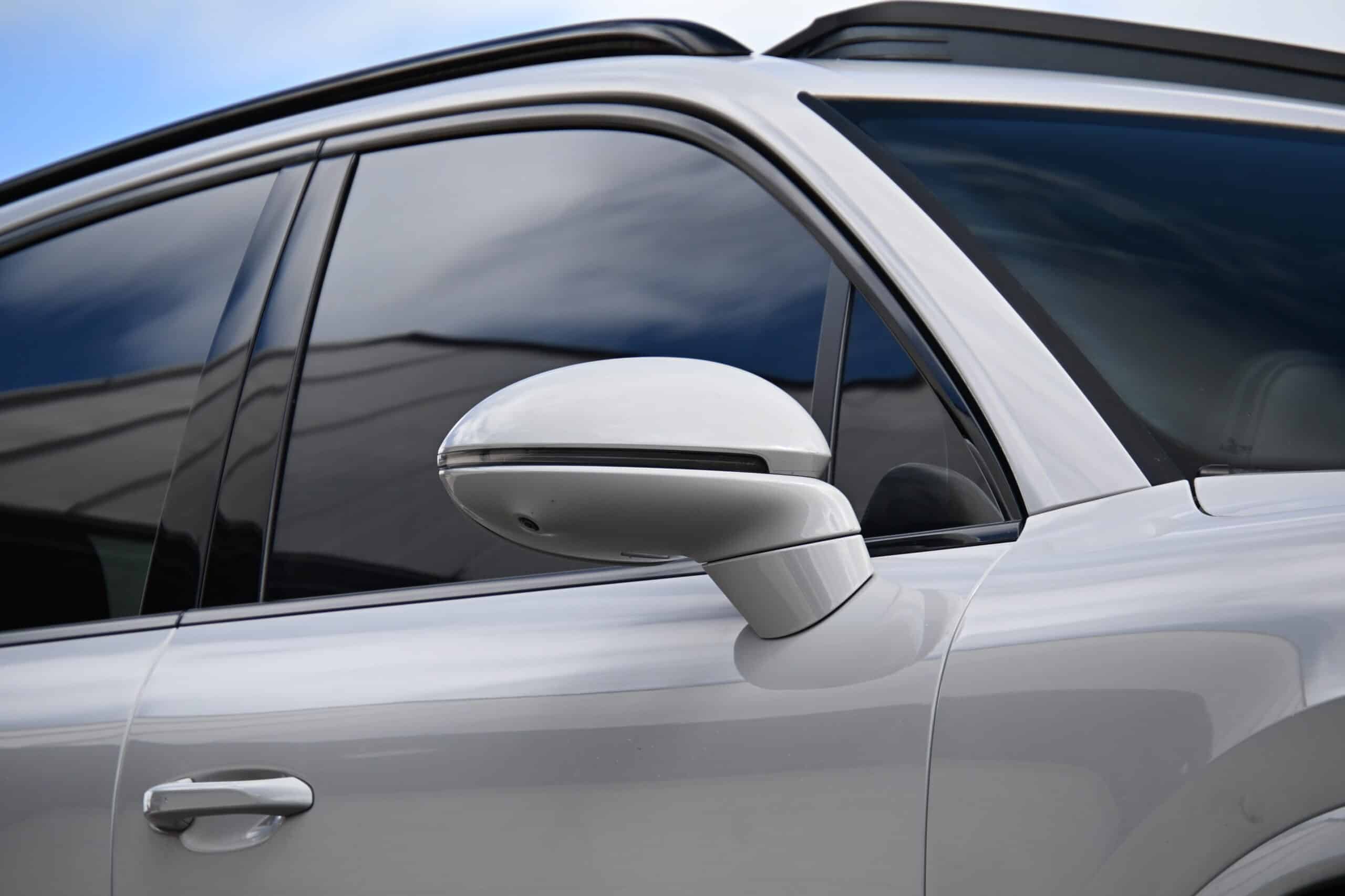 2022 Porsche Cayenne — Classic car exterior with side mirror and tinted windows.