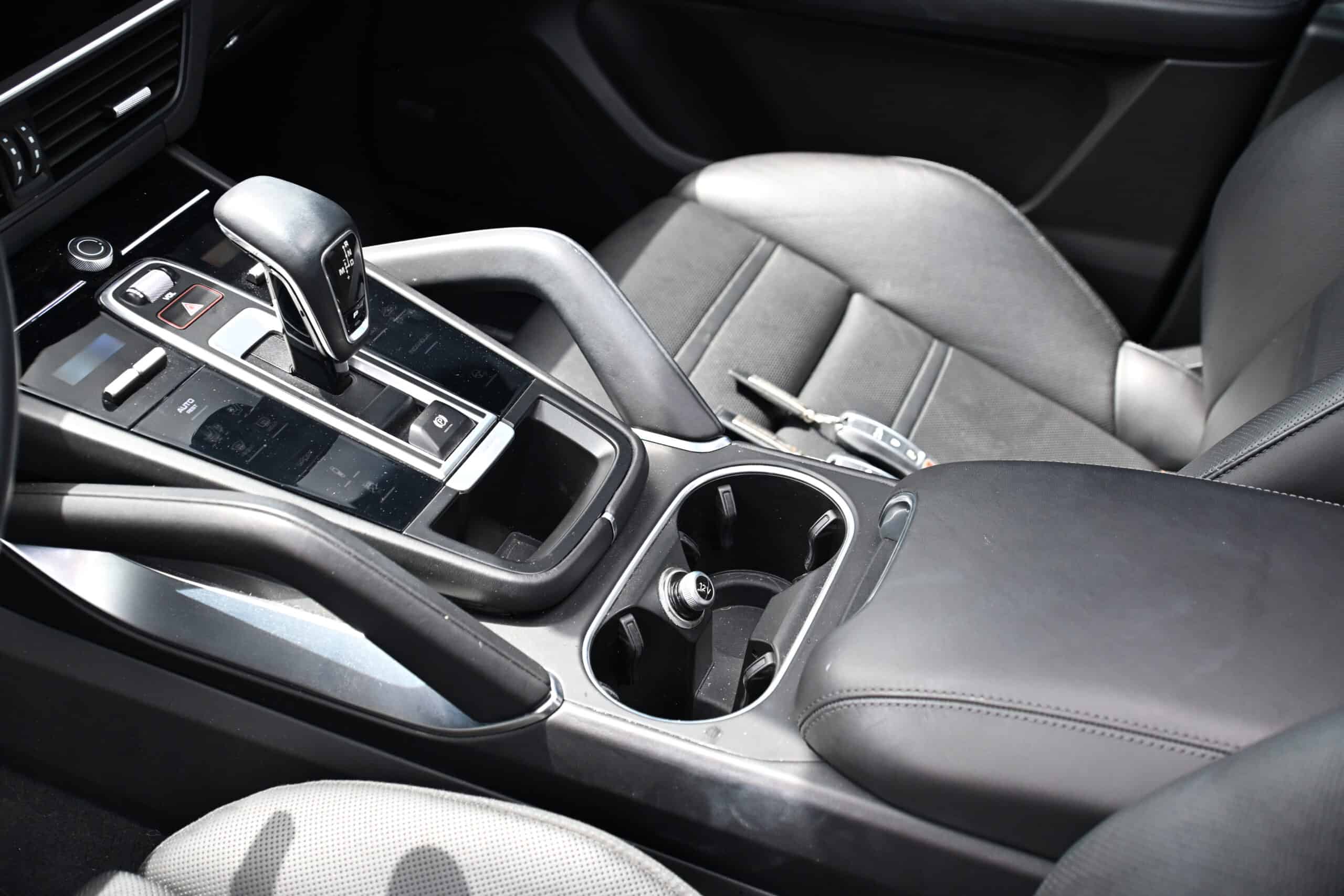 2022 Porsche Cayenne — Interior shot of a classic car showing gear shift and center console.