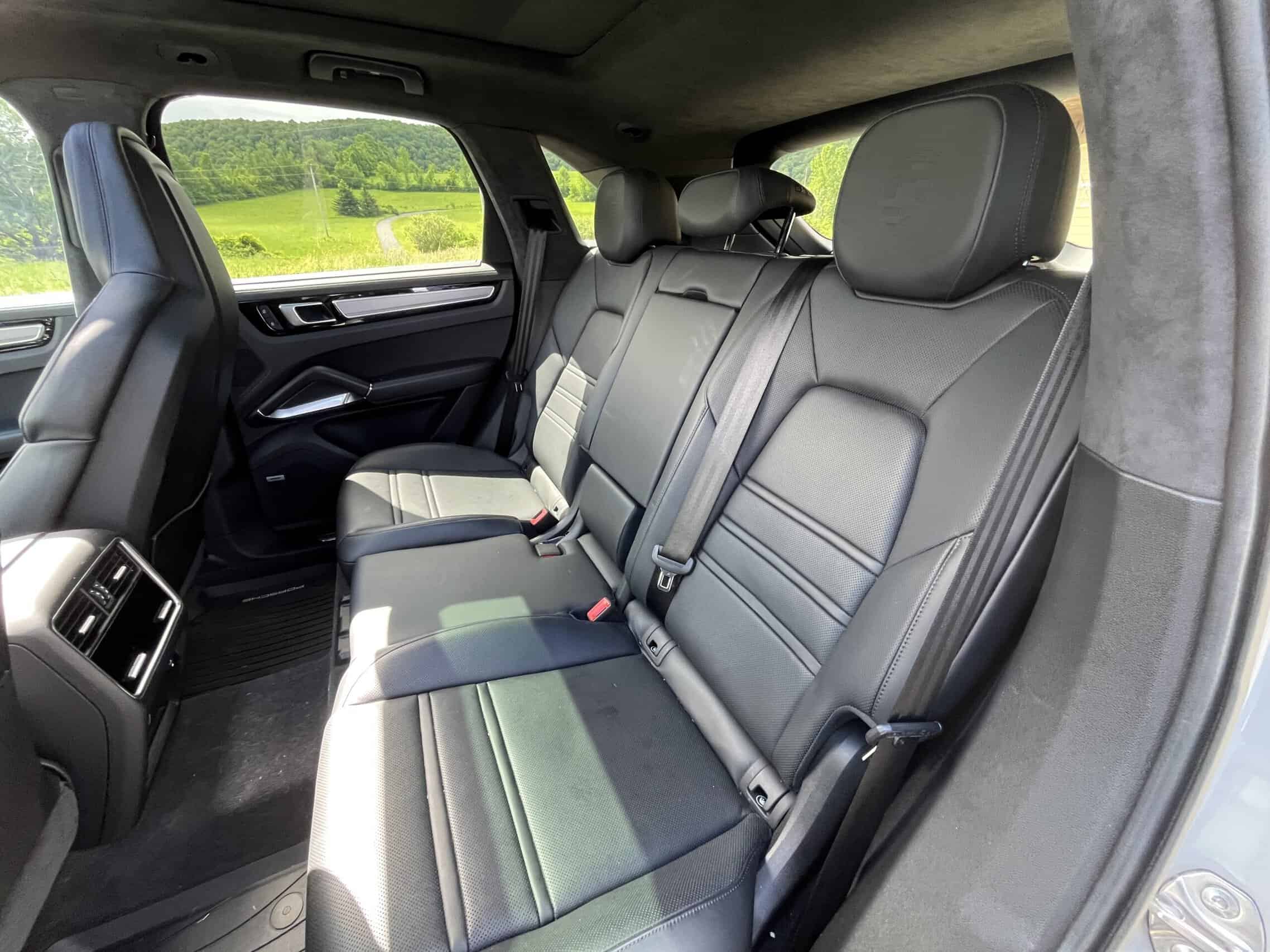 2022 Porsche Cayenne — Interior of a classic car with leather seats and headrests.