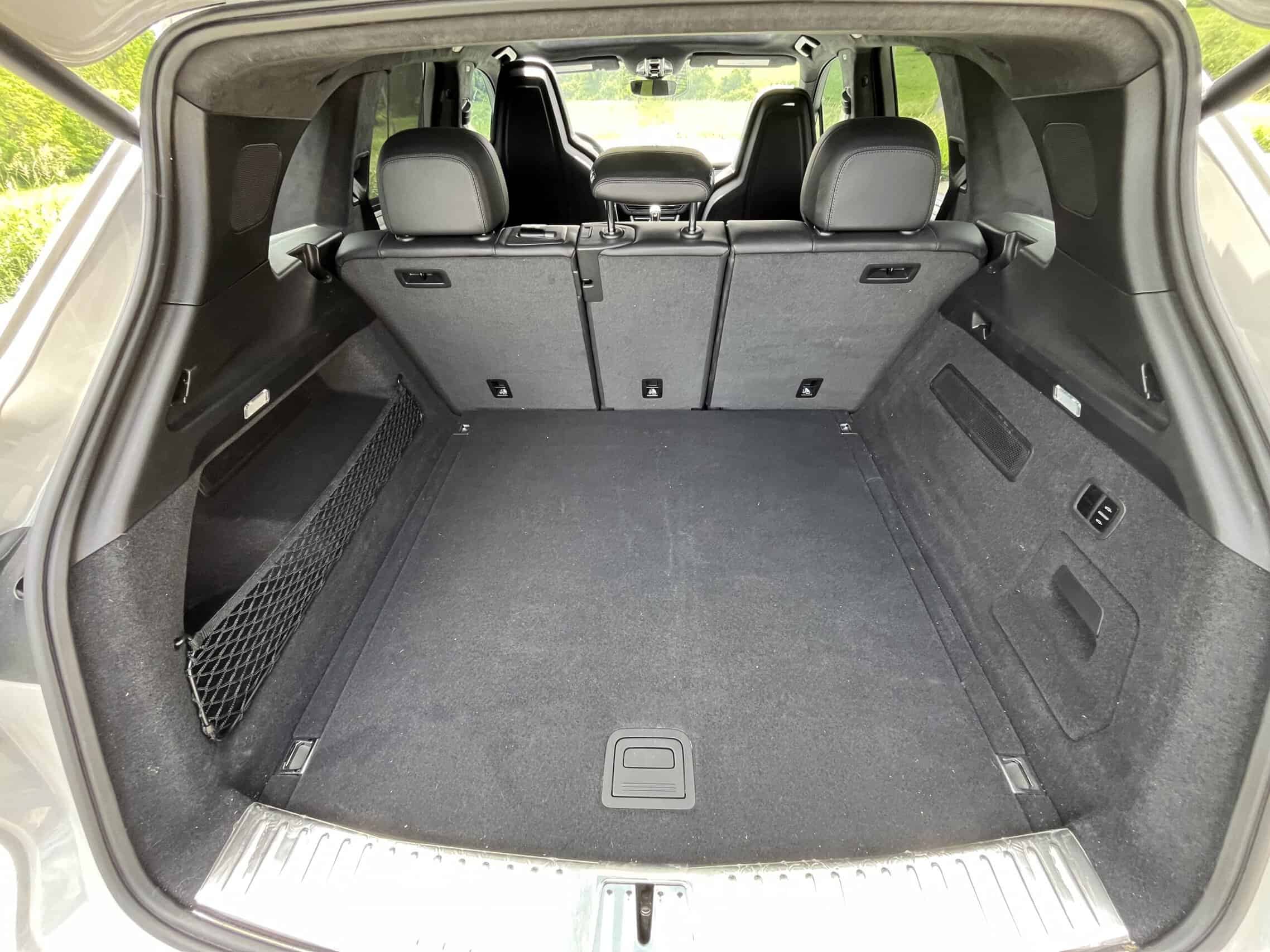 2022 Porsche Cayenne — Interior of a classic car showing spacious cargo area with seats folded.