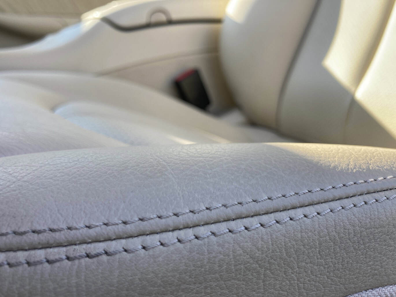 1999 Mercedes CLK500 — Interior shot of a classic car seat with light-colored upholstery.