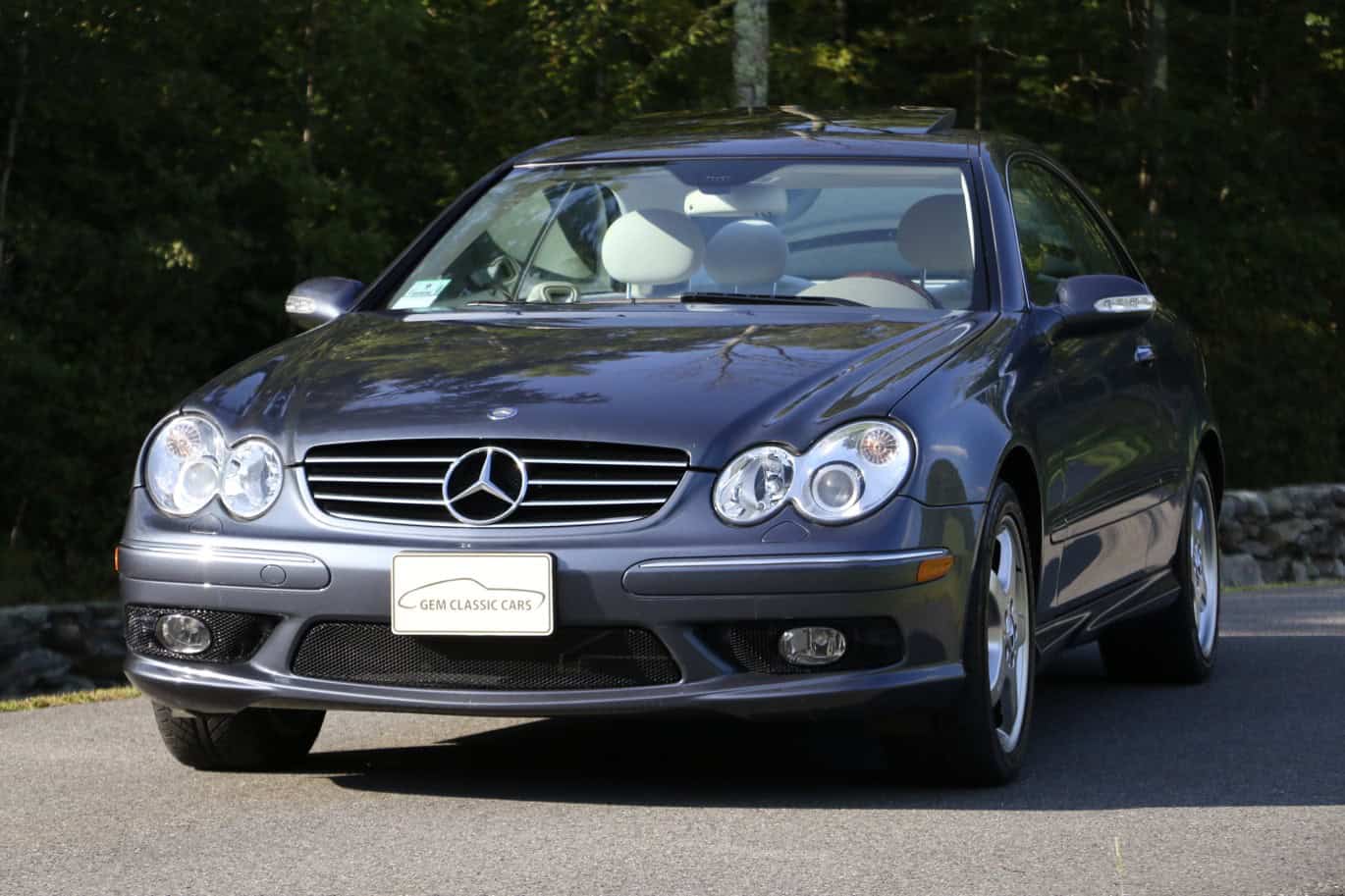 1999 Mercedes CLK500 — Exterior view of a classic car with silver body and convertible top.