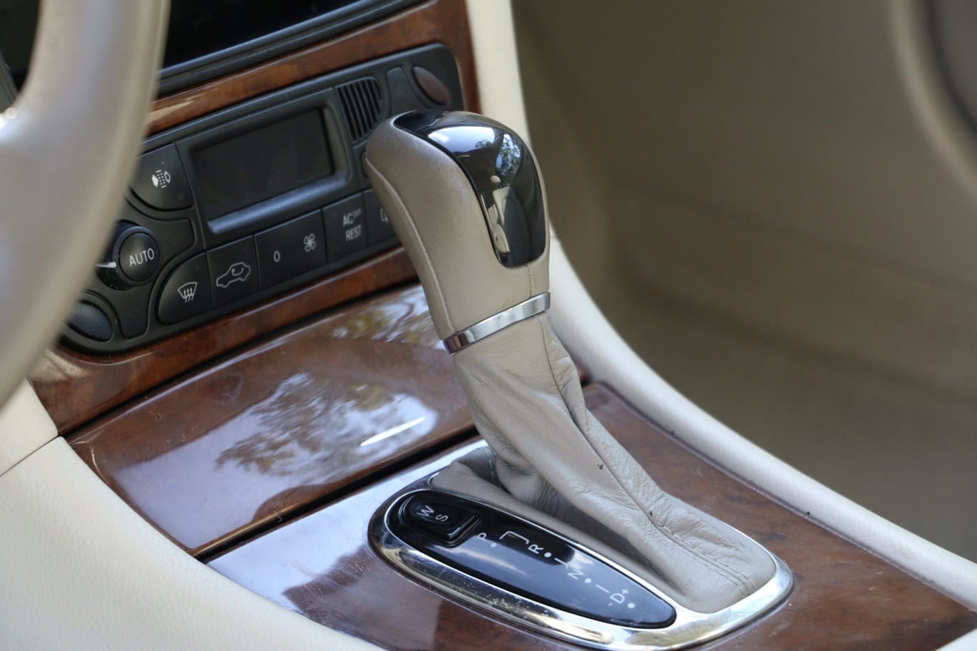 1999 Mercedes CLK500 — Interior shot of a classic car with automatic transmission and wood trim.