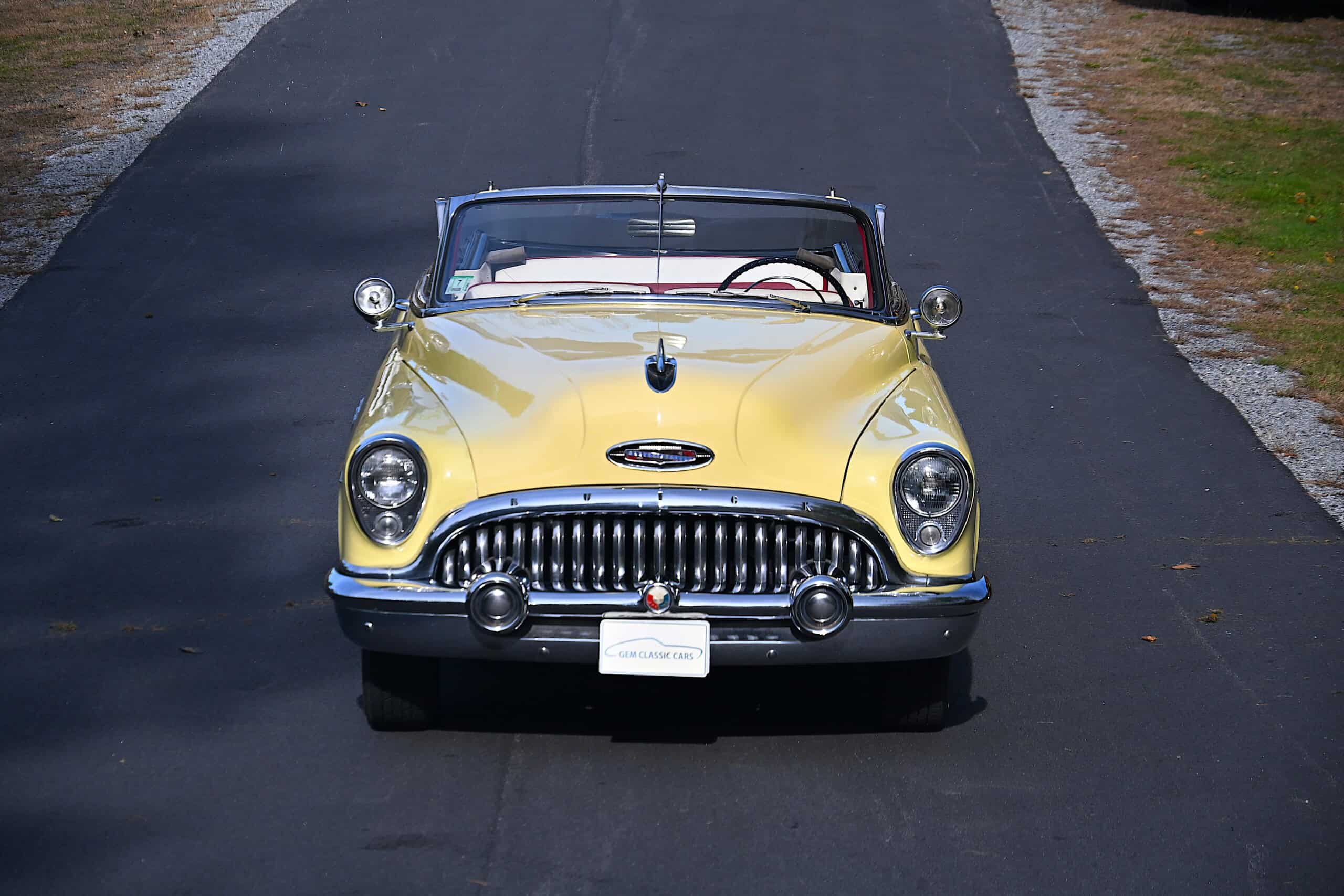 1953 Buick special — Yellow classic car convertible on a paved road, front view.