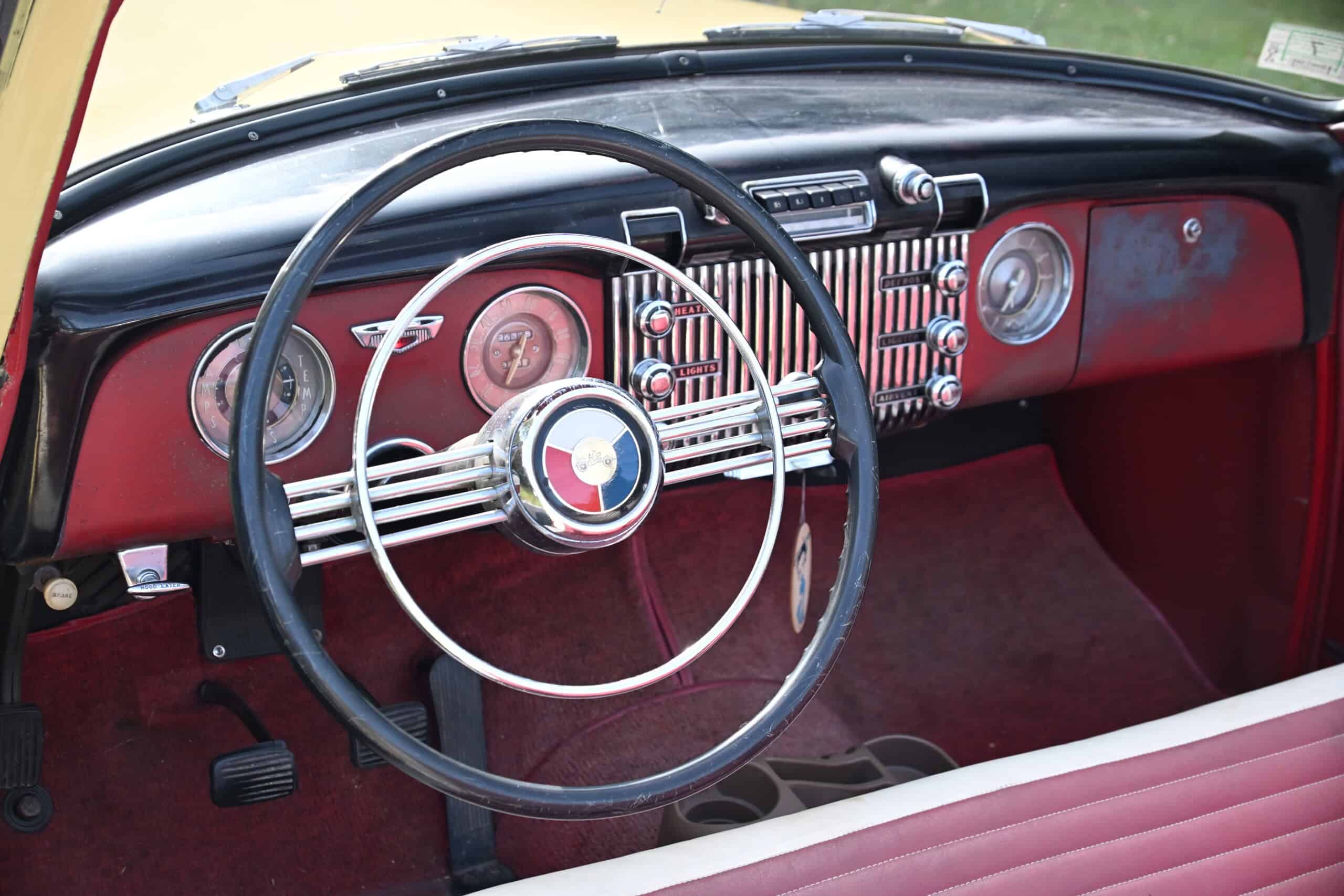 1953 Buick special — Interior view of a classic car with dashboard and steering wheel.