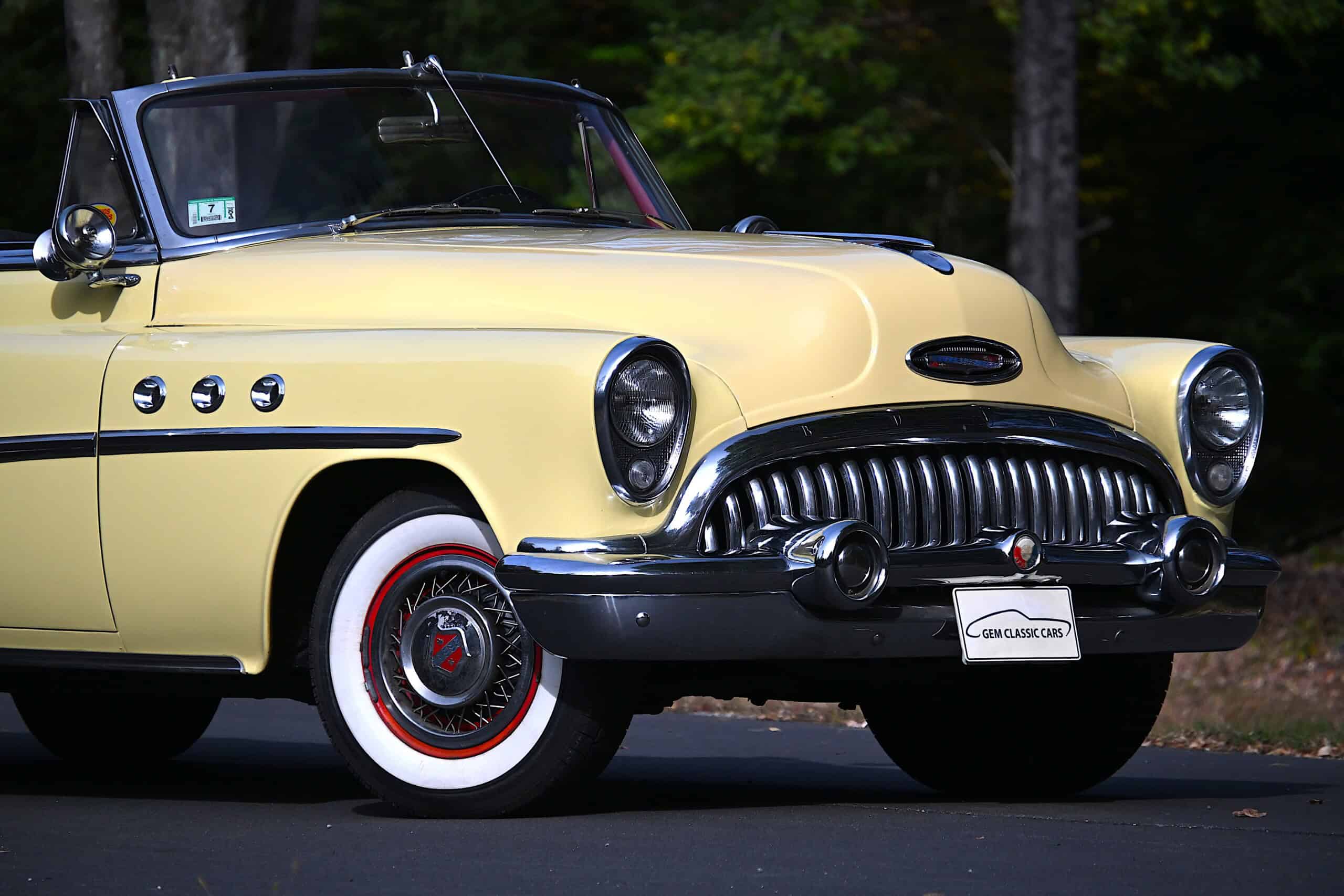 1953 Buick special — Yellow classic car with black grille and whitewall tires.