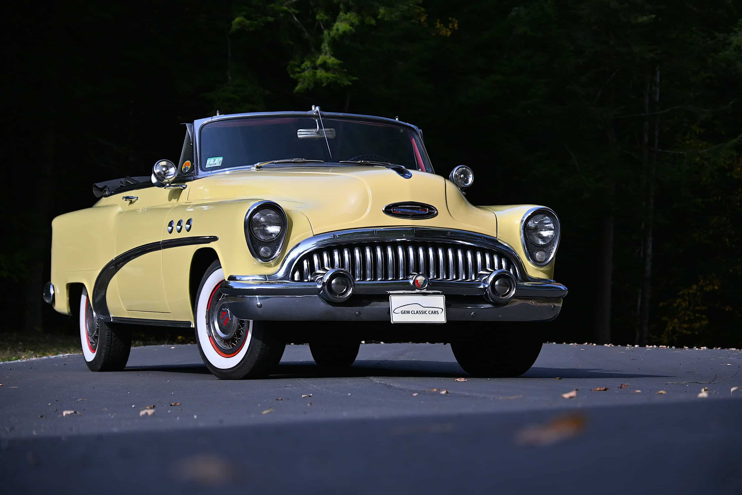 1953 Buick special — Yellow classic car convertible with chrome grille and whitewall tires.