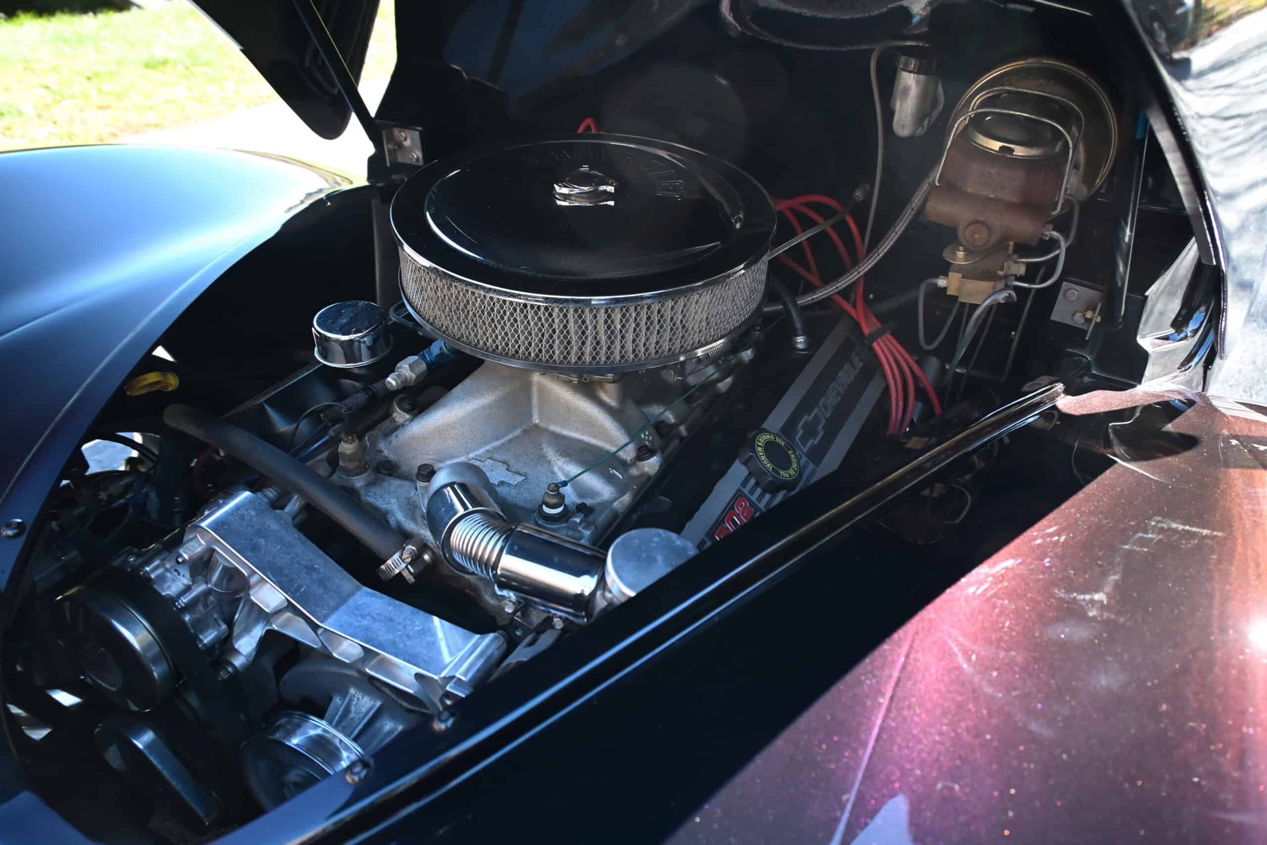 1941 Willys Custom Street Rod — Close-up of a classic car engine with visible components and air filter.