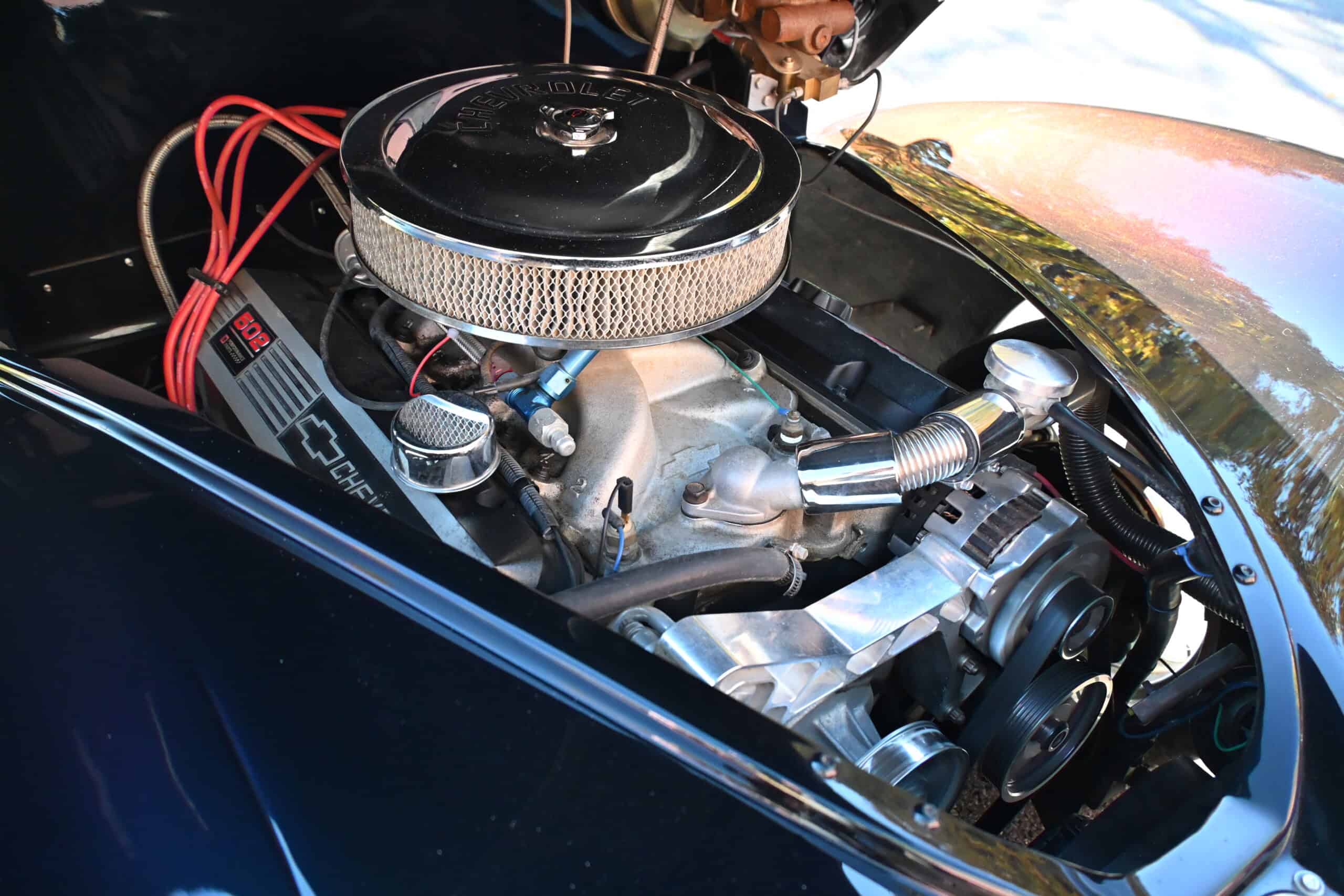 1941 Willys Custom Street Rod — Close-up of classic car engine with chrome air filter and belts.
