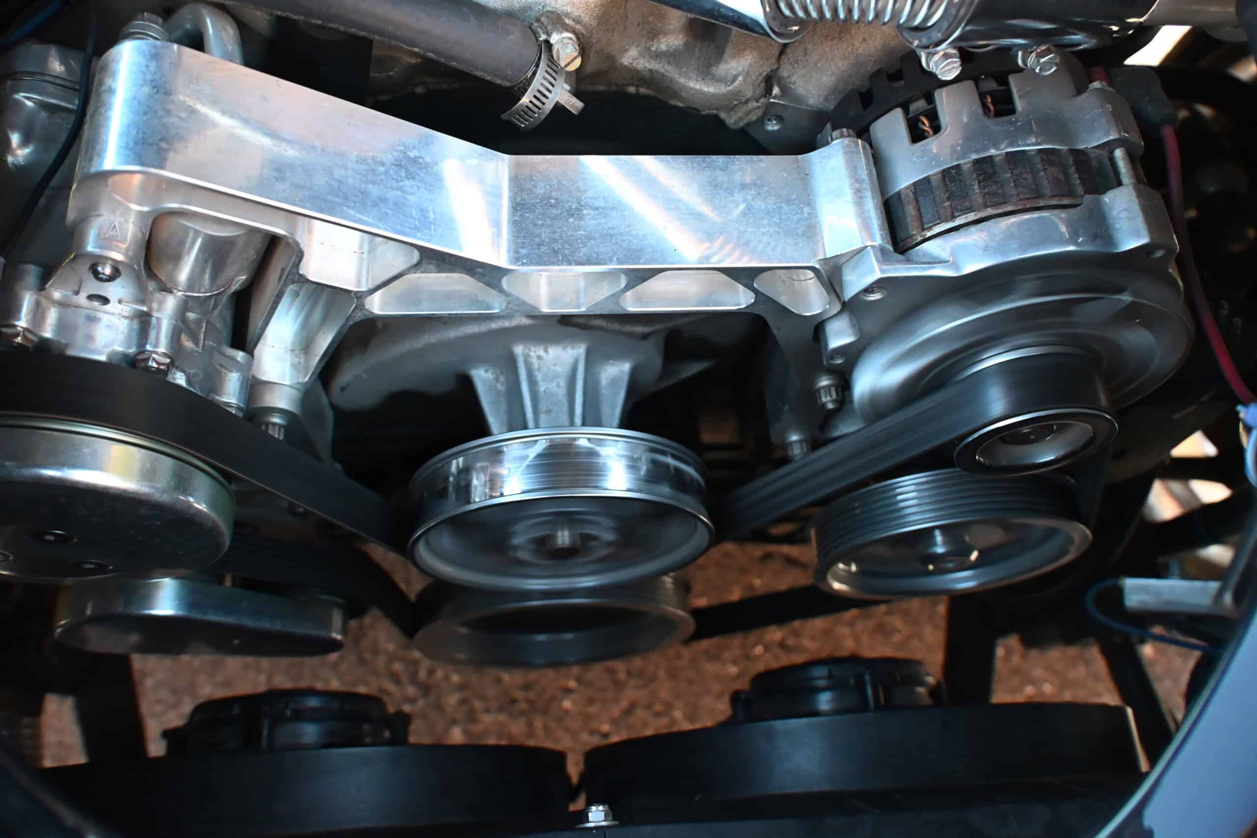 1941 Willys Custom Street Rod — Close-up of engine with pulleys and belts in a classic car.