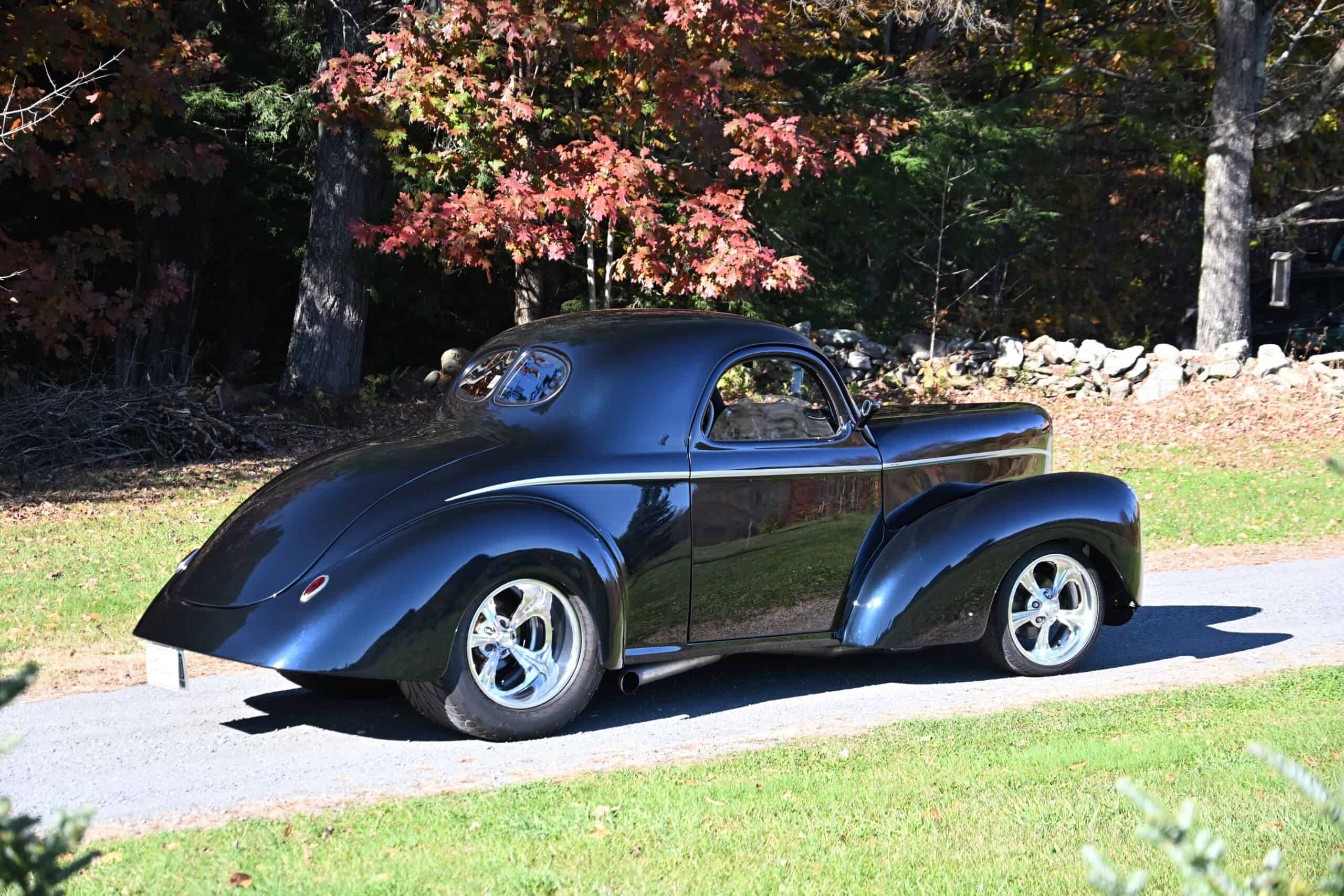 1941 Willys Custom Street Rod — Black classic car with rounded body and chrome wheels.