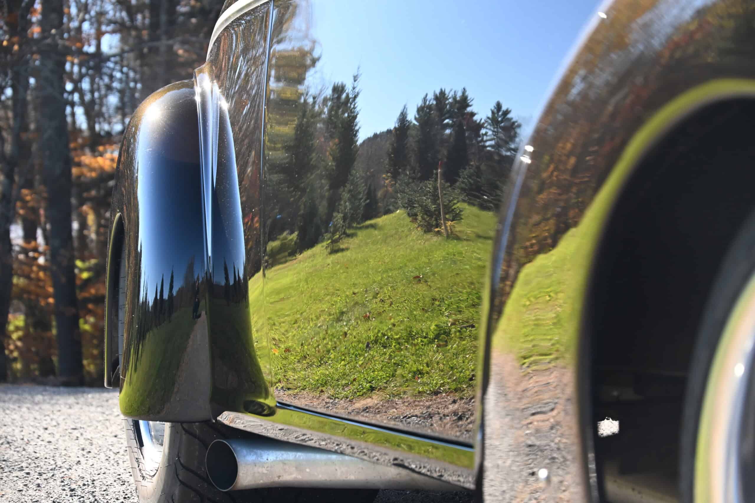 1941 Willys Custom Street Rod — Close-up of classic car door with reflection of trees and sky.