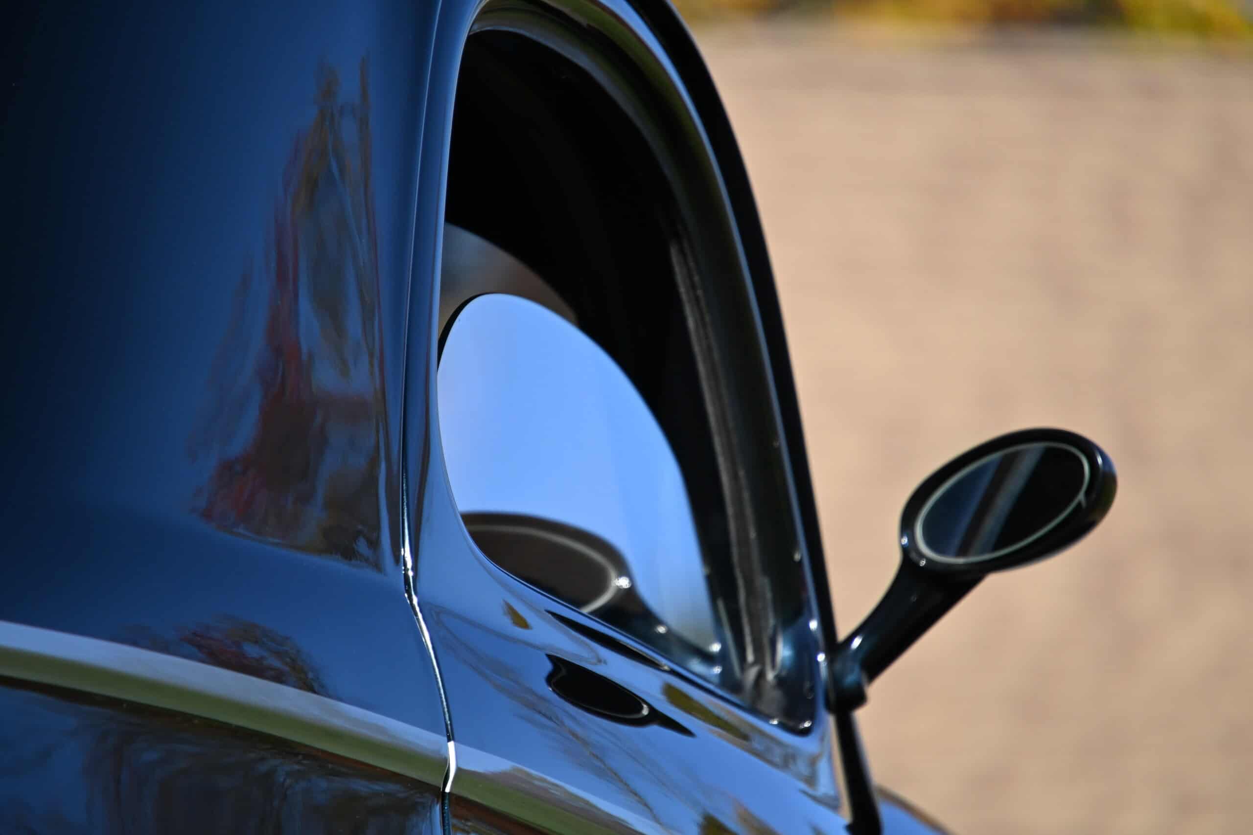 1941 Willys Custom Street Rod — Close-up of classic car exterior with side mirror and window.