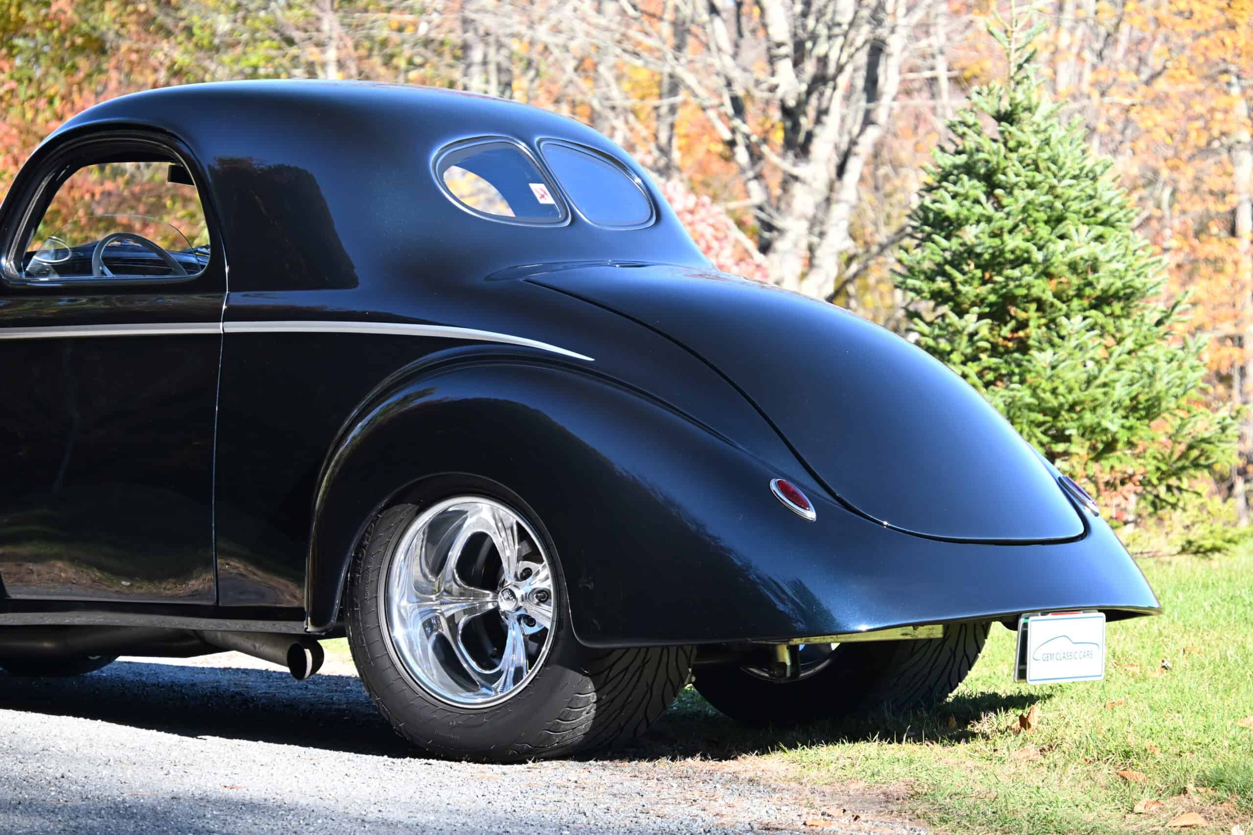 1941 Willys Custom Street Rod — Black classic car with rounded body and chrome wheels.