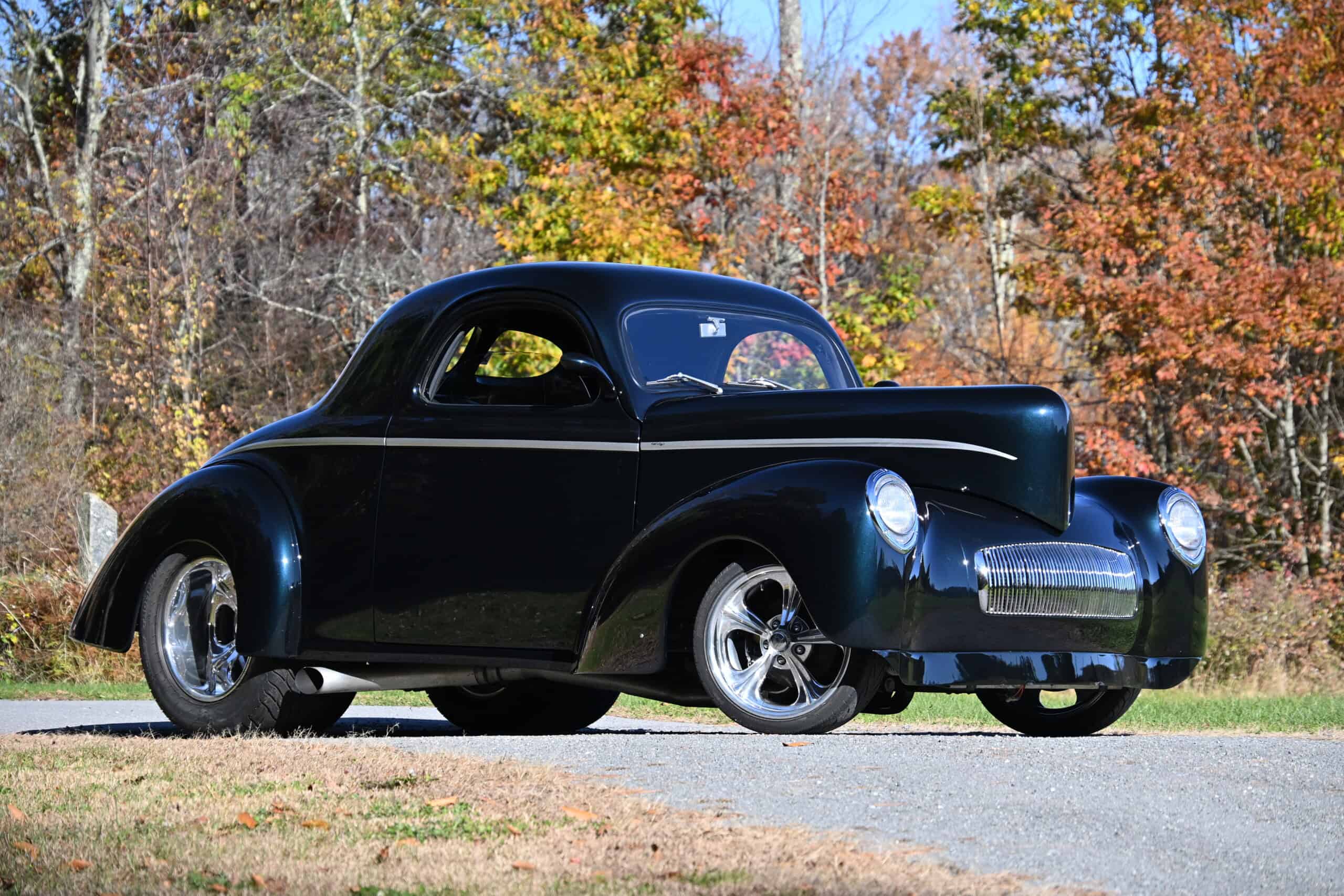 1941 Willys Custom Street Rod — Vintage black classic car with chrome wheels parked outdoors.