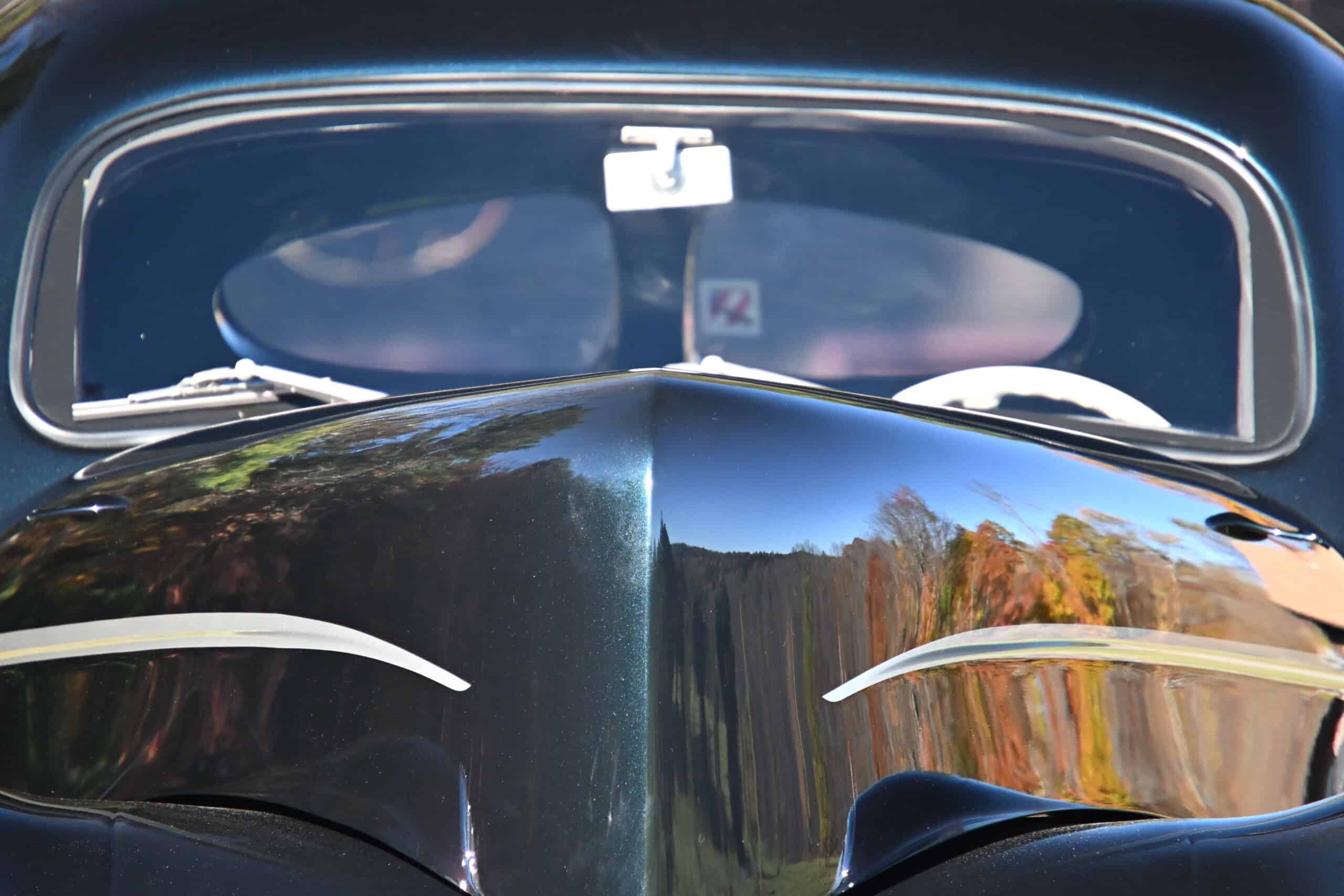 1941 Willys Custom Street Rod — Close-up of the front of a classic car with black paint and chrome details.