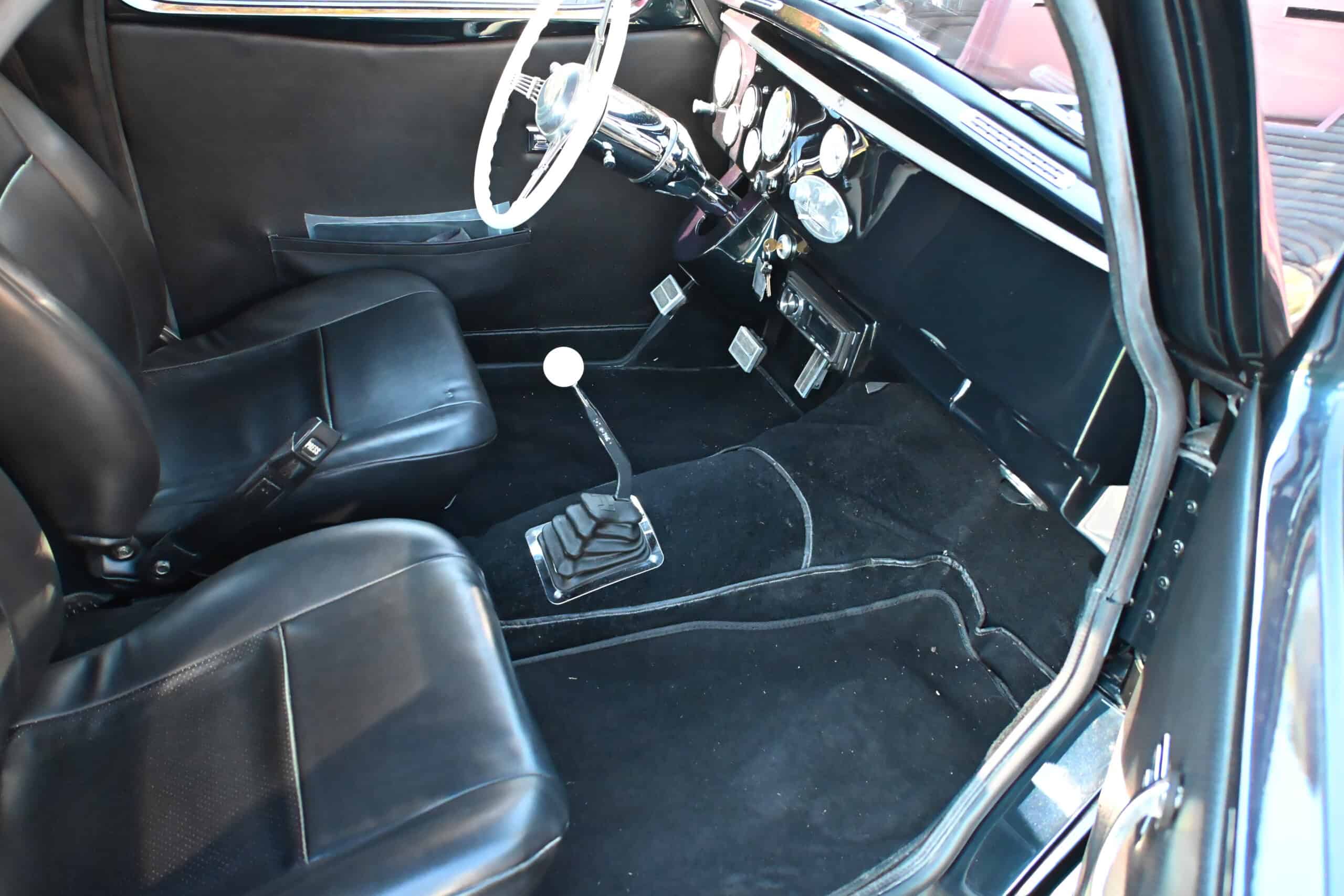 1941 Willys Custom Street Rod — Interior view of a classic car showing seats, dashboard, and gear shift.