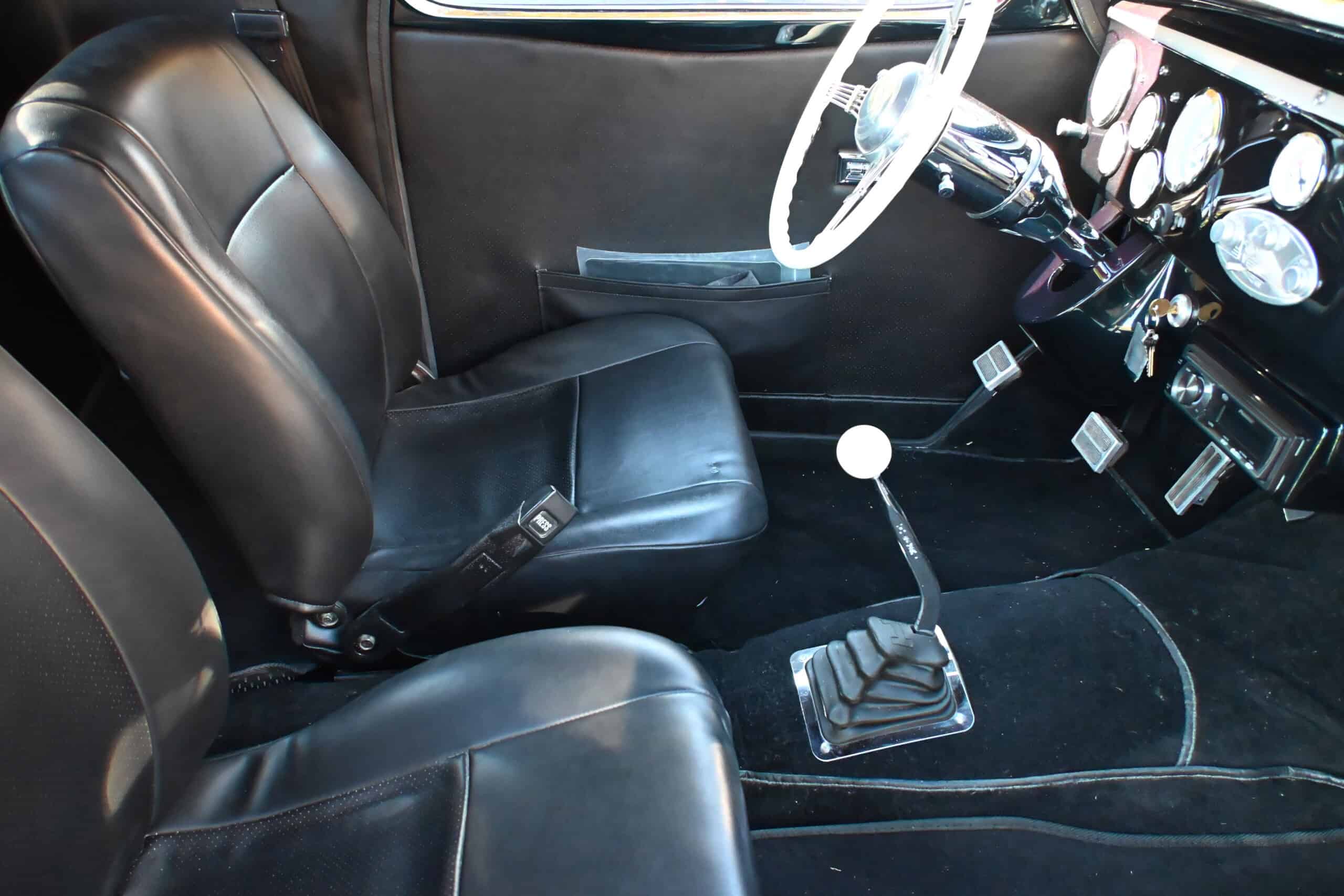 1941 Willys Custom Street Rod — Interior shot of a classic car showing seats, steering wheel, and dashboard.