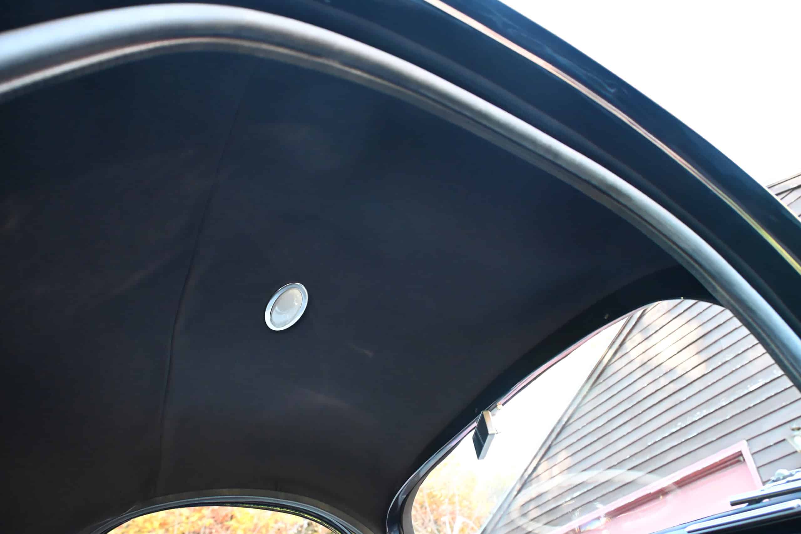 1941 Willys Custom Street Rod — Close-up of classic car interior roof with light fixture.