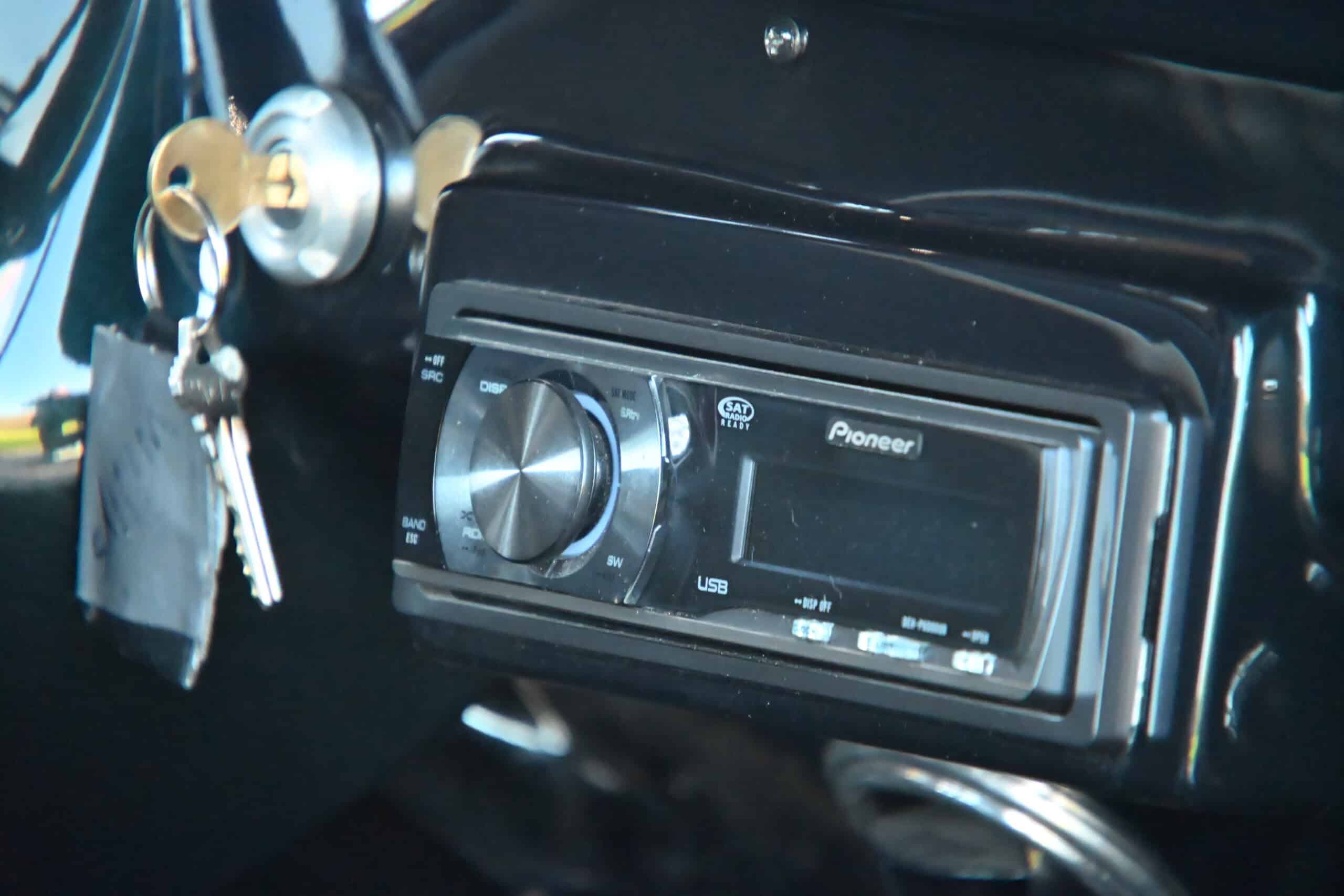 1941 Willys Custom Street Rod — Close-up of car stereo and ignition keys in classic car interior.