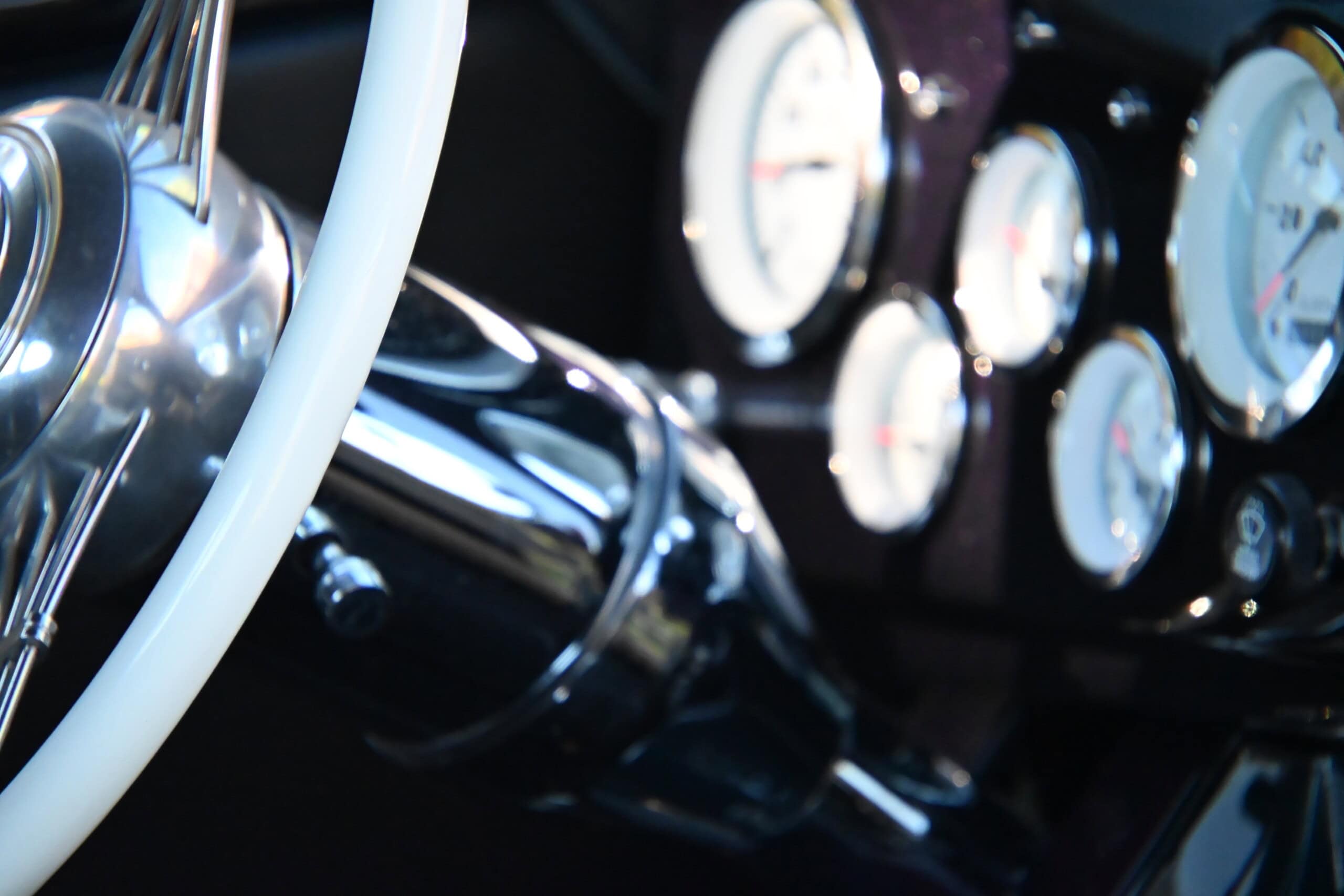 1941 Willys Custom Street Rod — Close-up of classic car dashboard with gauges and steering wheel.