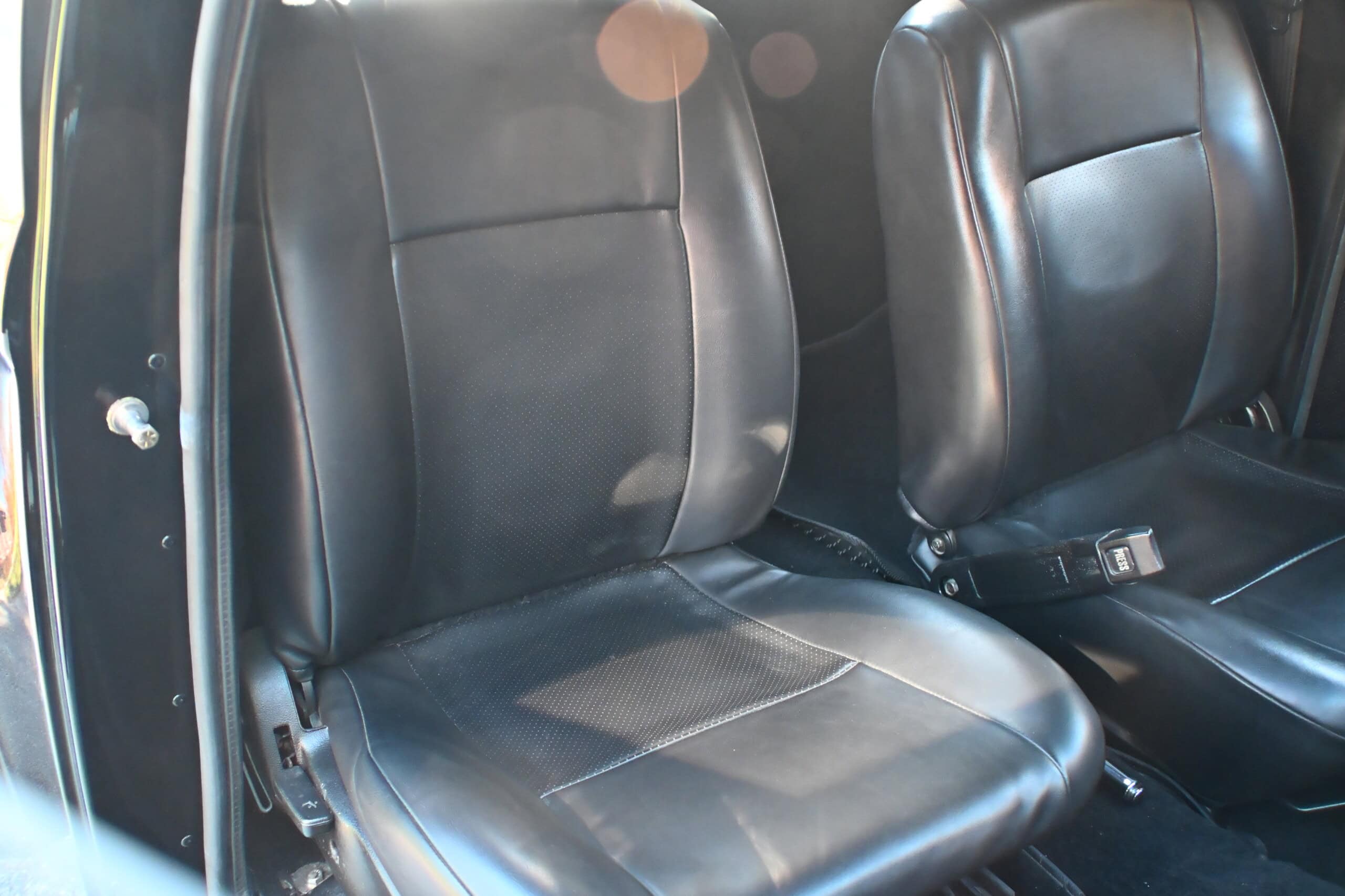 1941 Willys Custom Street Rod — Black leather interior seats of a classic car.