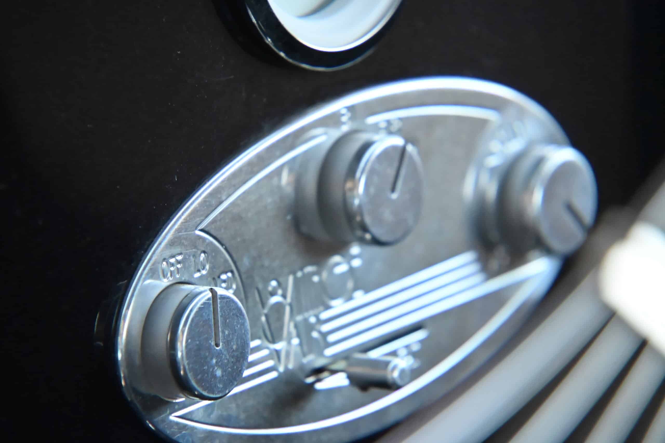 1941 Willys Custom Street Rod — Close-up of classic car interior control panel with knobs and switches.