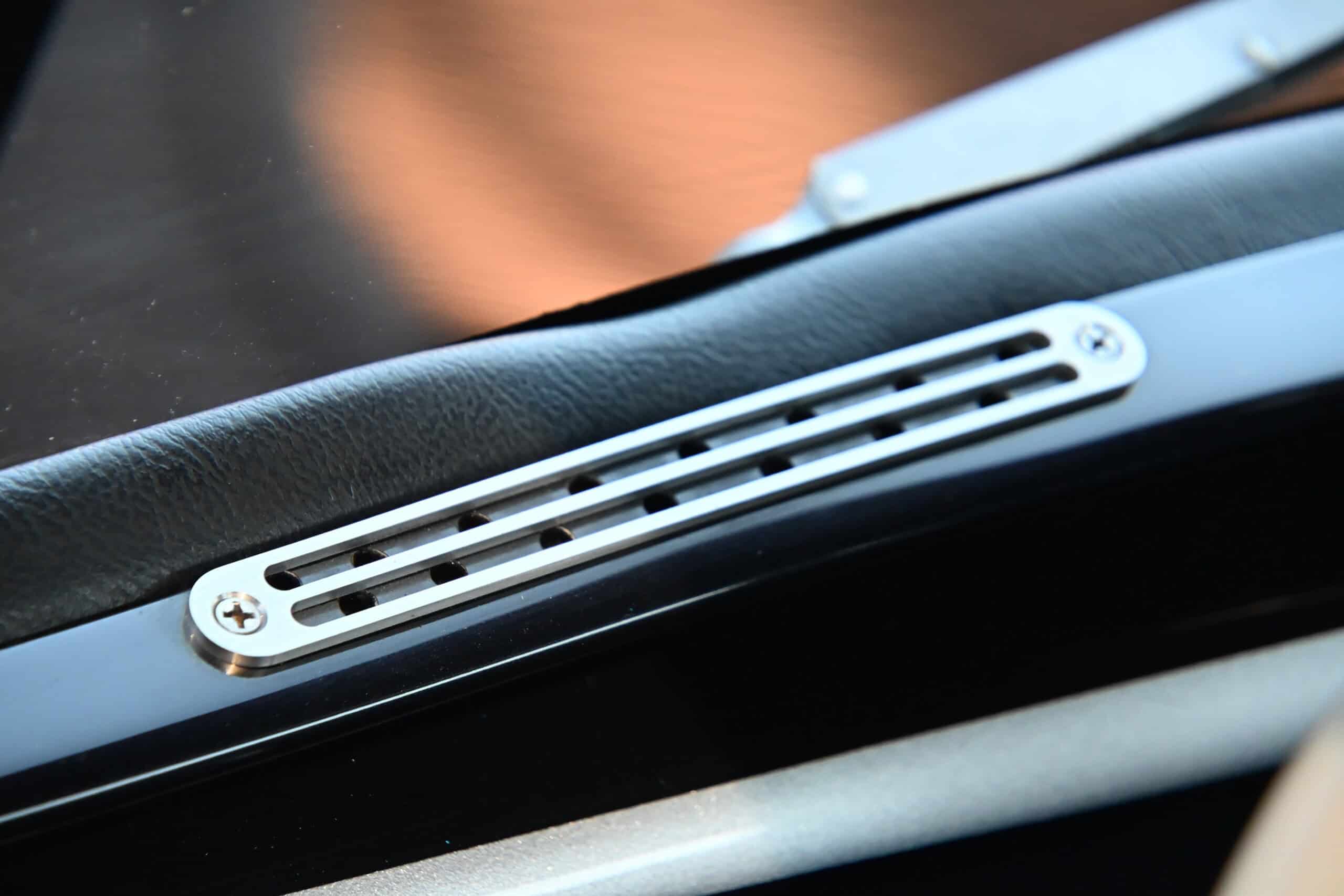1941 Willys Custom Street Rod — Close-up of dashboard vent in a classic car interior.