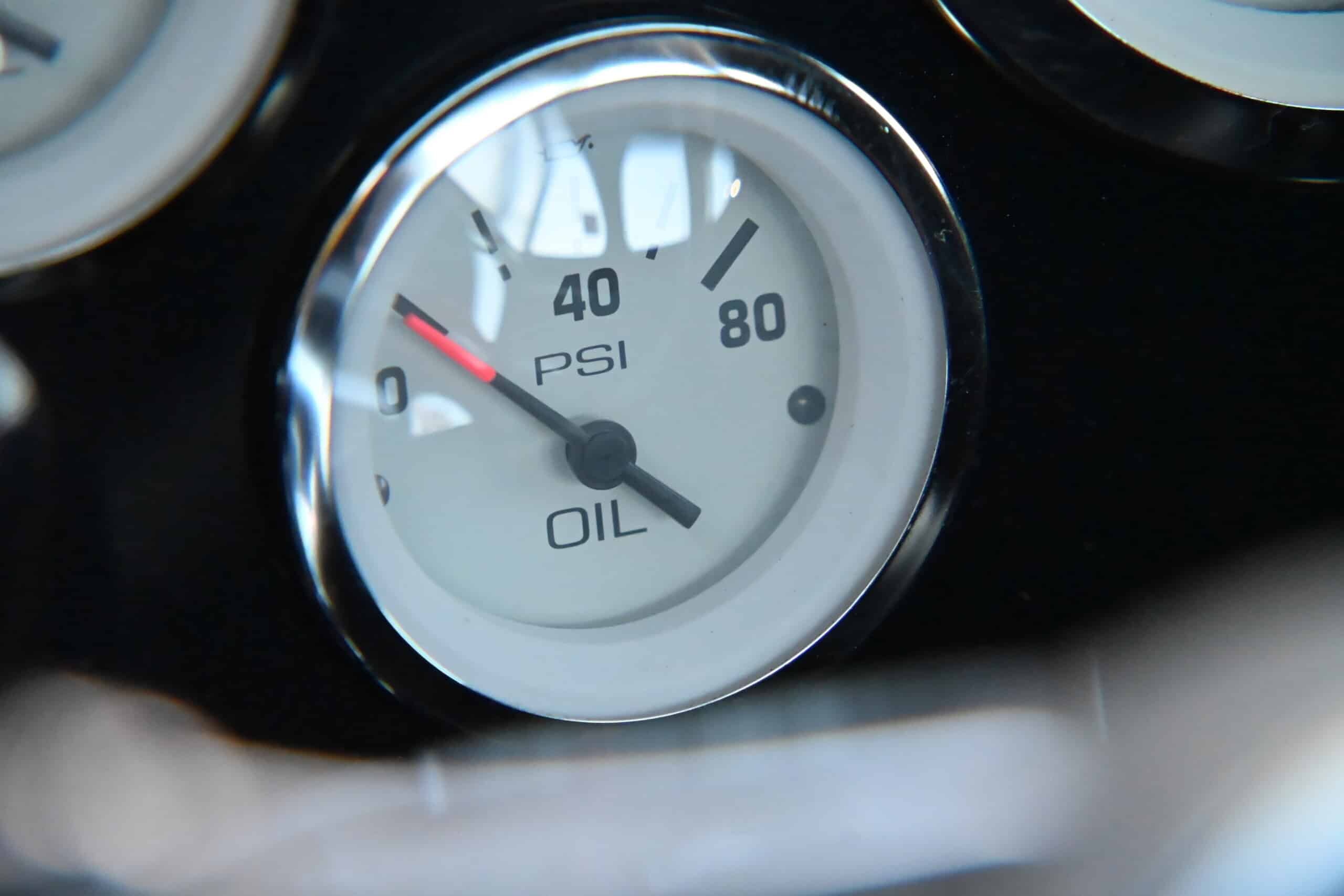 1941 Willys Custom Street Rod — Close-up of classic car dashboard oil and pressure gauge.