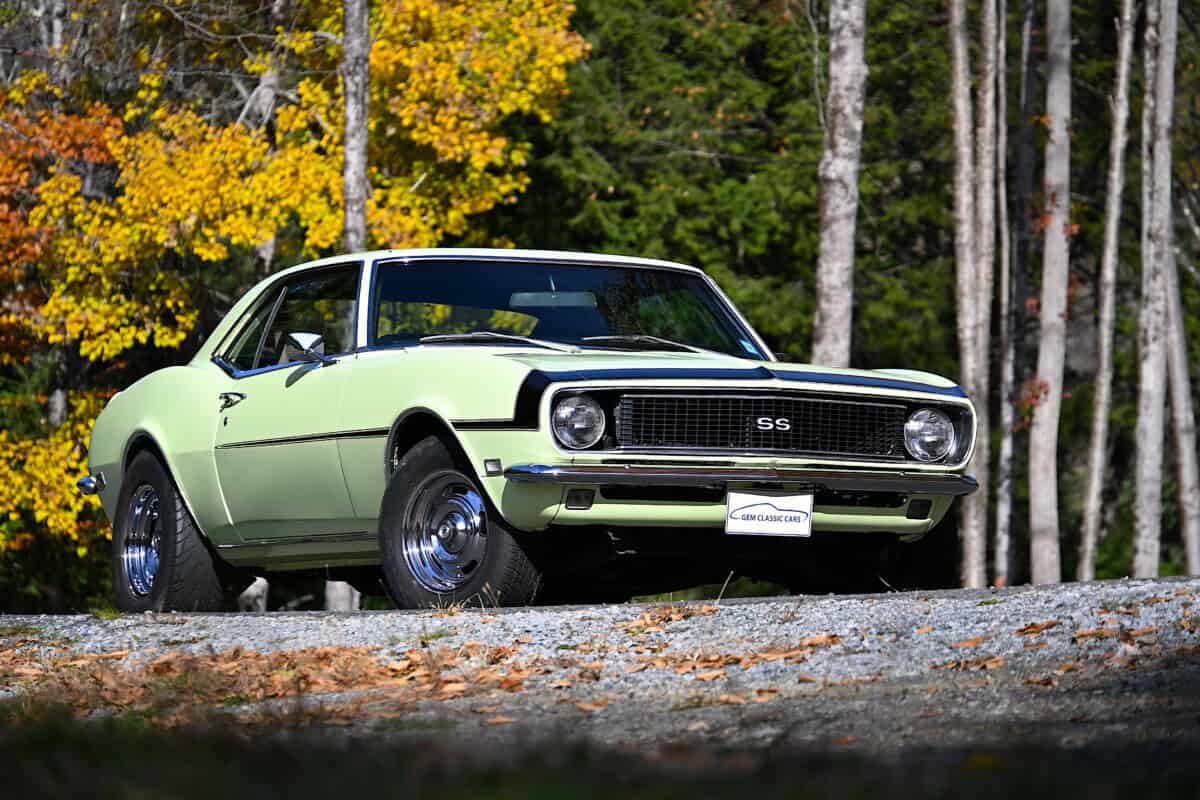 Exterior view of a classic car with black and light green colors.