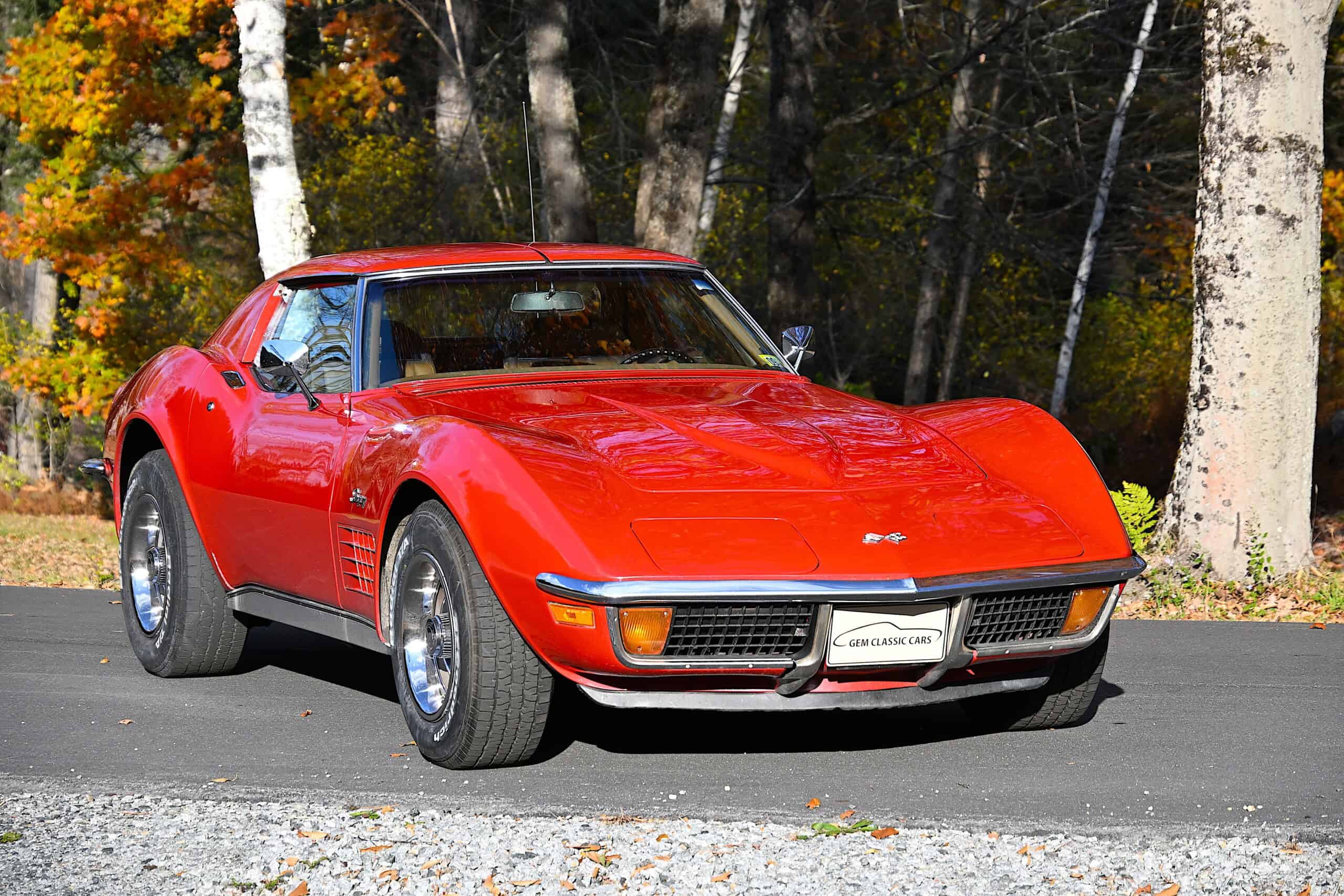 1972 Chevrolet corvette — Red classic car with sleek body and sporty design on road.